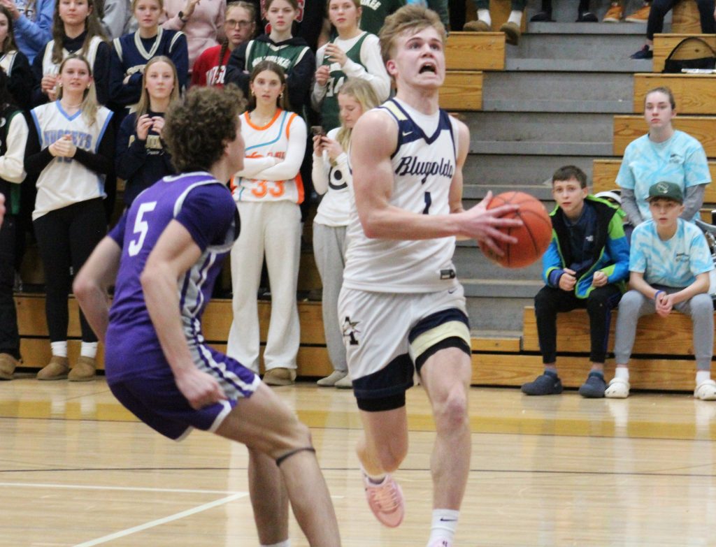 Calvin Bahr takes the ball to the hoop during a game against Onalaska last season. -- TODD SOMMERFELDT PHOTO