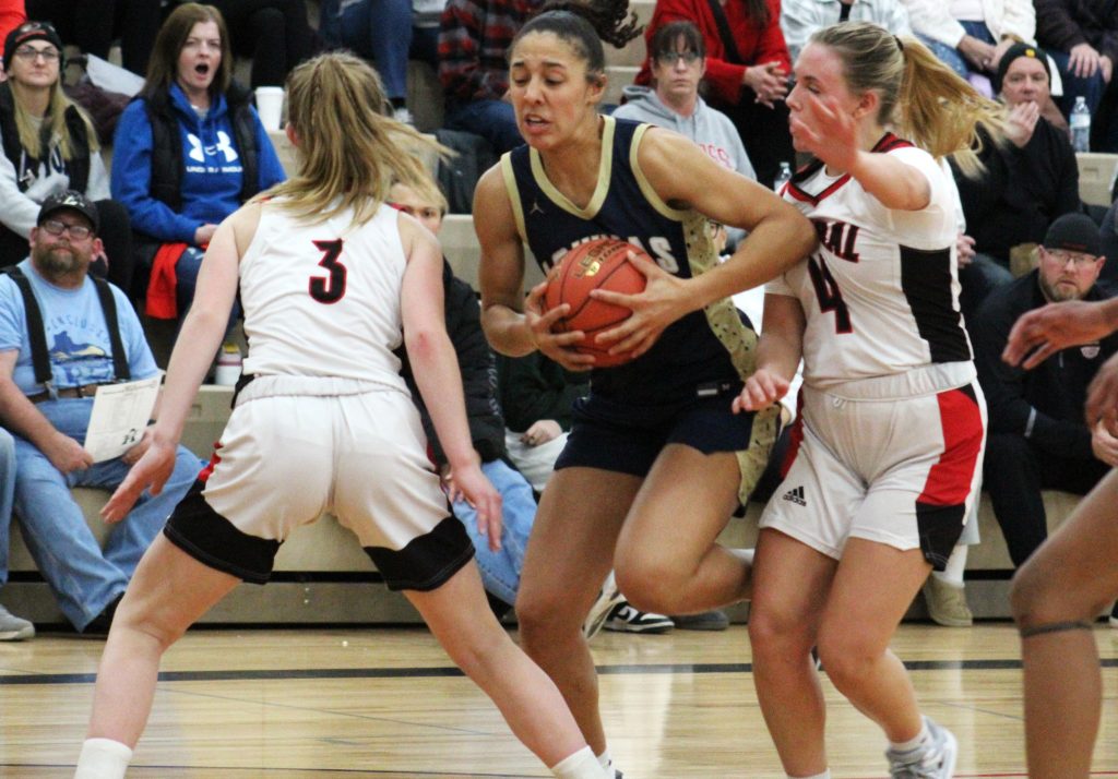 Aquinas senior Sammy Davis, shown in a game against Central last season, scored 33 points in a 70-16 MVC victory over Holmen on Tuesday. -- TODD SOMMERFELDT PHOTO