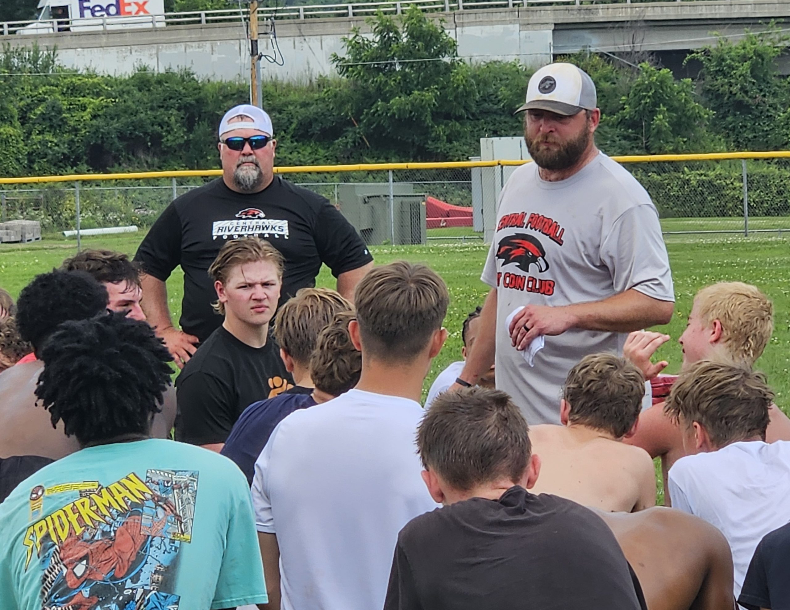 Central football coach Mitch Olson talks to his team after a one-hour practice on Monday. -- TODD SOMMERFELDT PHOTO