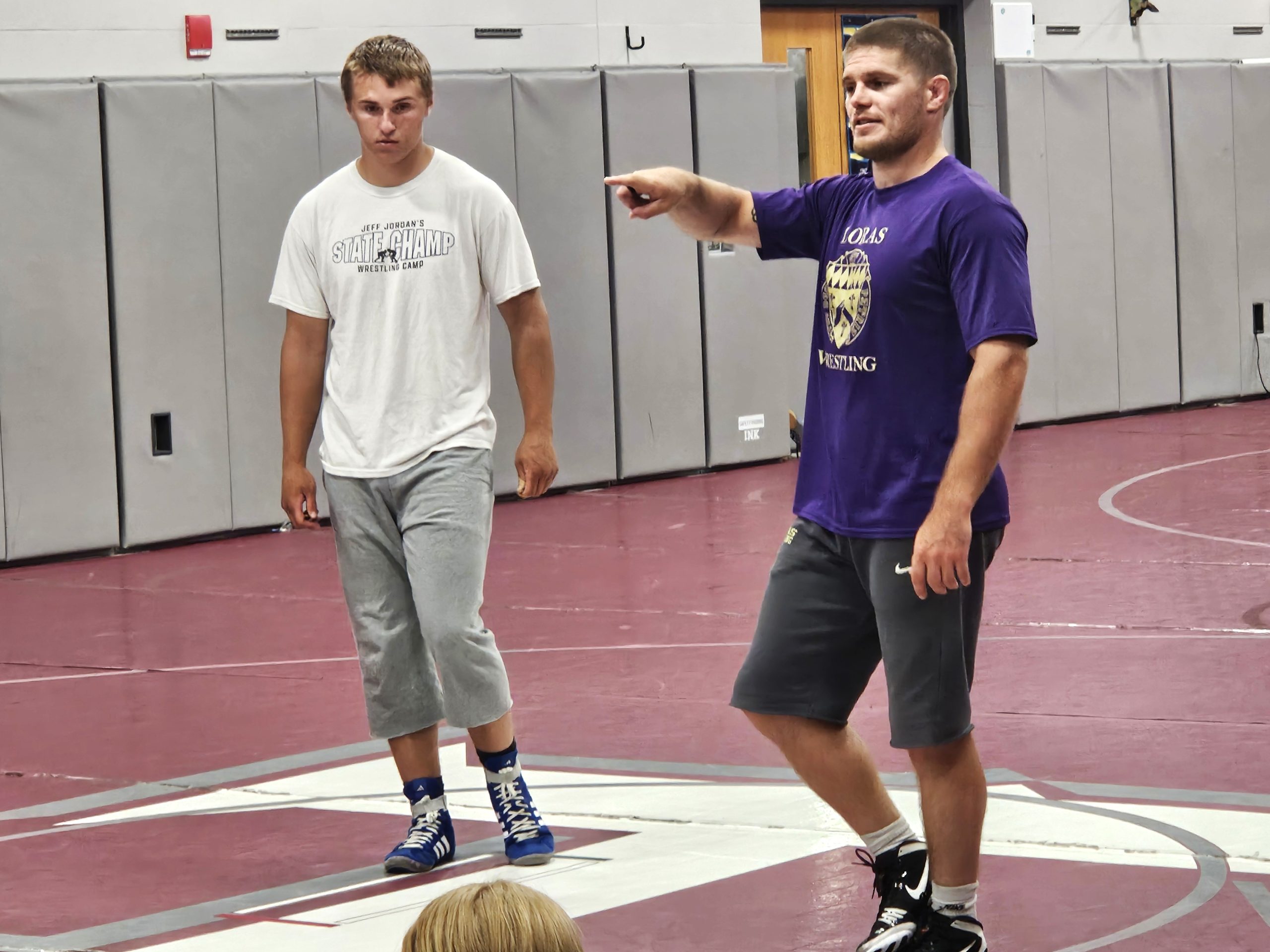 Loras wrestling coach Devin Bahr address his campers during a clinIc at Holmen High School. -- TODD SOMMERFELDT PHOTO