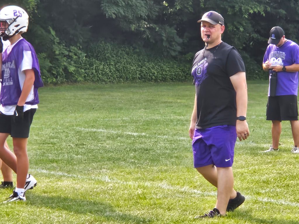 Onalaska football coach Tom Yashinsky keeps an eye on Monday's joint practice with Aquinas. -- TODD SOMMERFELDT PHOTO