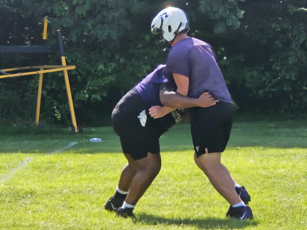 Onalaska senior tackle Aiden Knopp, right, works with a teammate during Tuesday's practice. -- TODD SOMMERFELDT PHOTO