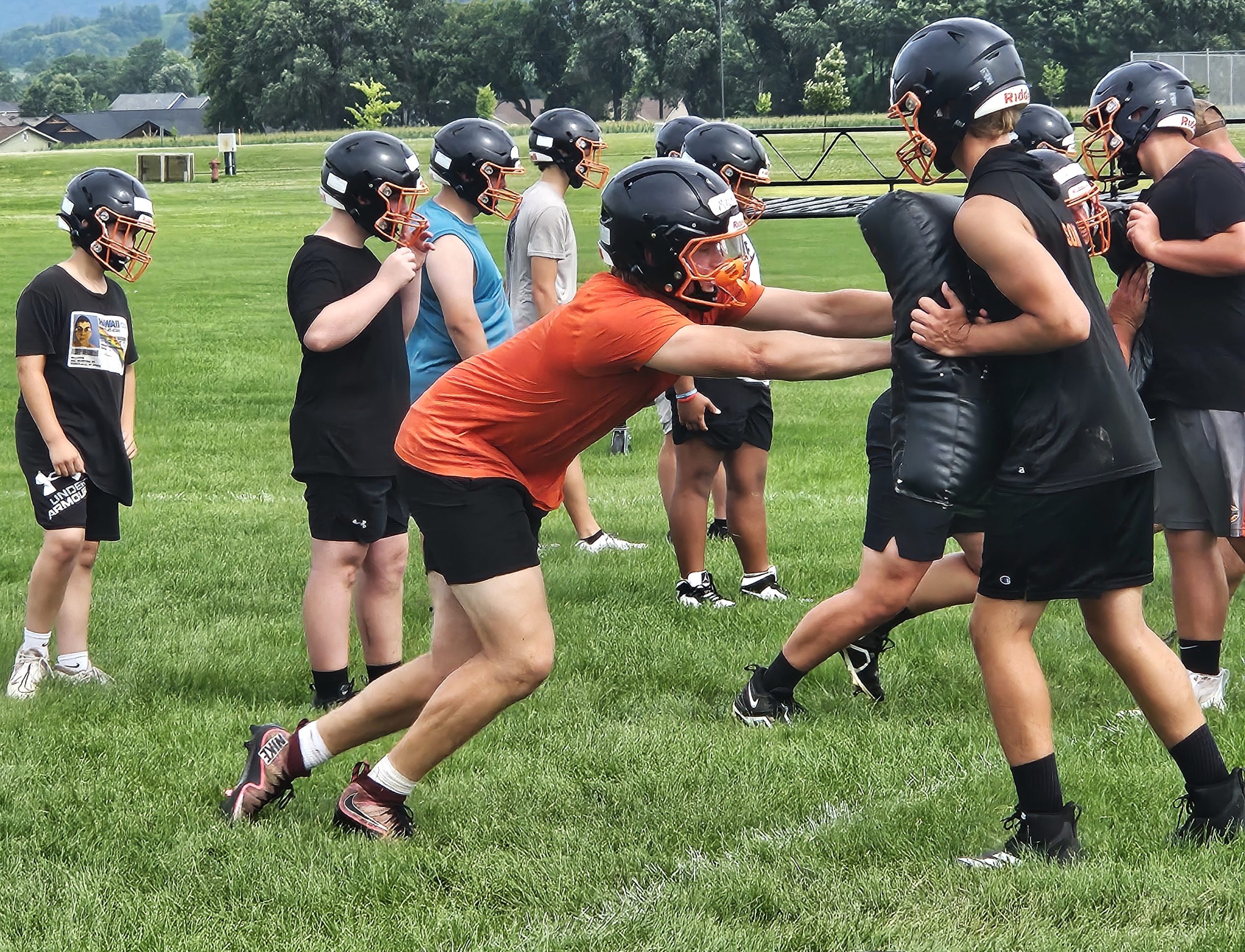 West Salem High School senior Landon Michlig hits the pad during a drill at Wednesday's practice. -- TODD SOMMERFELDT PHOTO