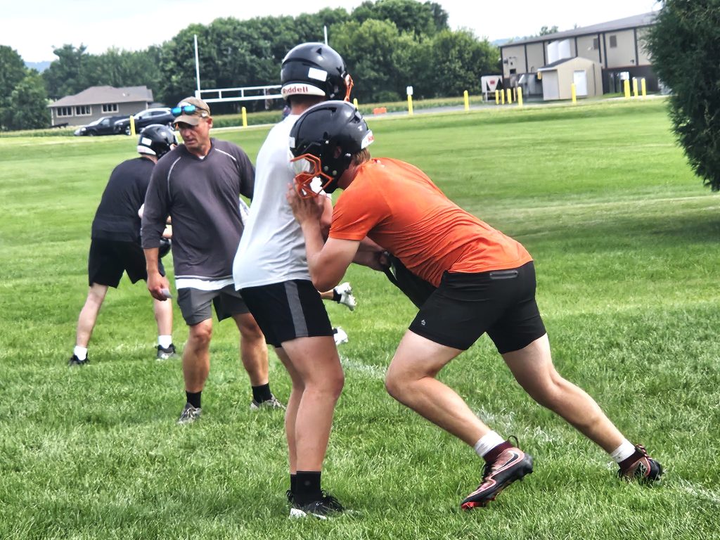West Salem High School senior Landon Michlig tries to get through a blocker during a drill at Wednesday's practice. -- TODD SOMMERFELDT PHOTO
