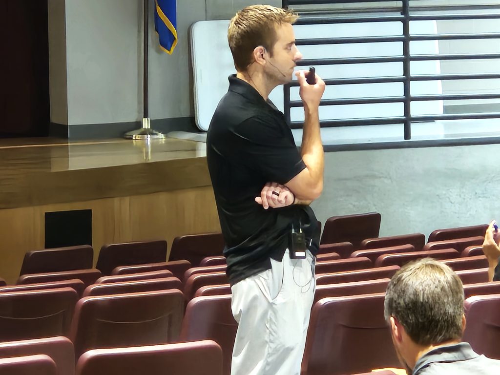 Levi Nelson listens to a coach while discussing positivity with athletes at Holmen High School. -- TODD SOMMERFELDT PHOTO