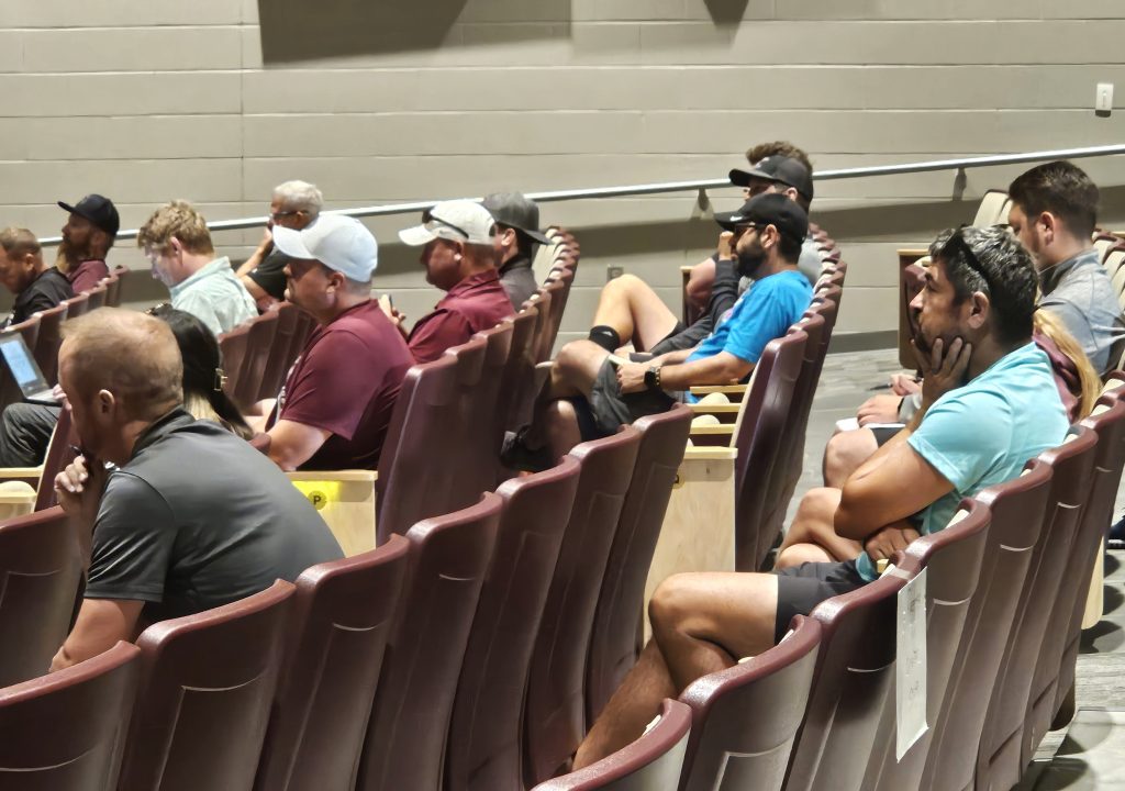 Coaches listen to a presentation about positivity and connection with athletes at Holmen High School. -- TODD SOMMERFELDT PHOTO
