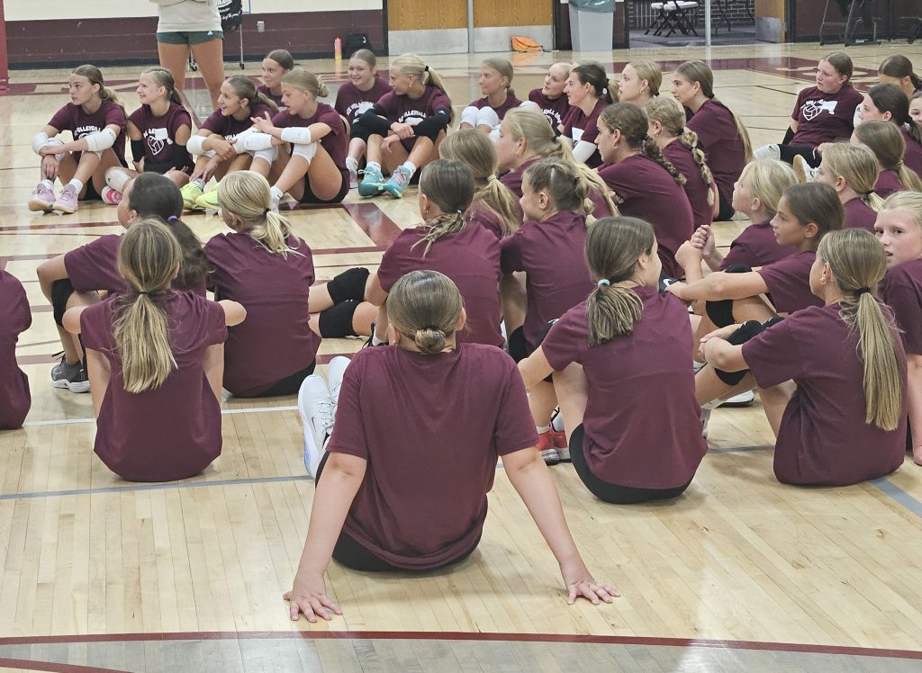 Campers listen to instruction from former Holmen volleyball standout Ellie Kline during her volleyball camp. -- TODD SOMMERFELDT PHOTO
