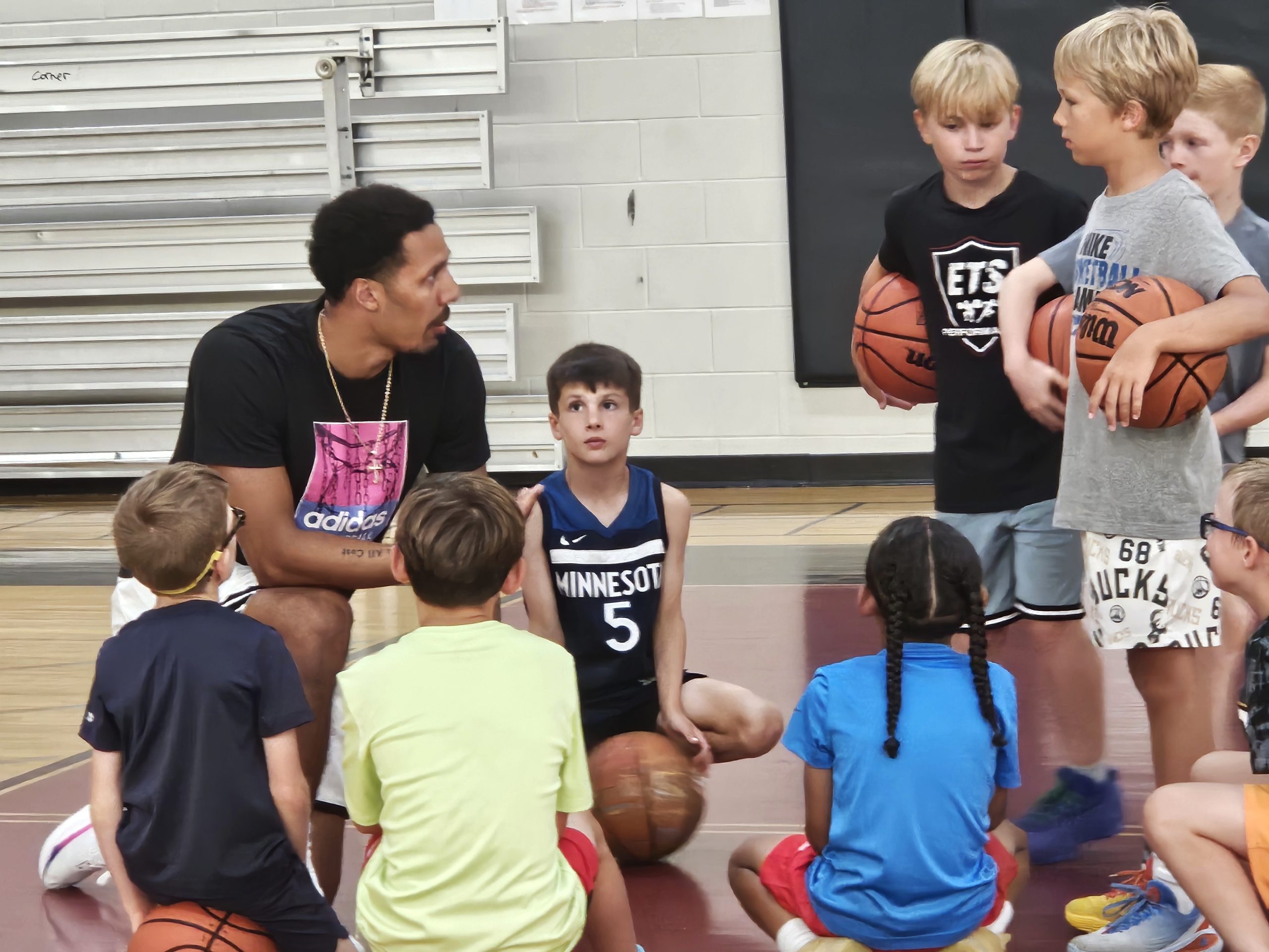 Jordan Davis talks to campers while hosting a training session at Central High School. -- TODD SOMMERFELDT PHOTO
