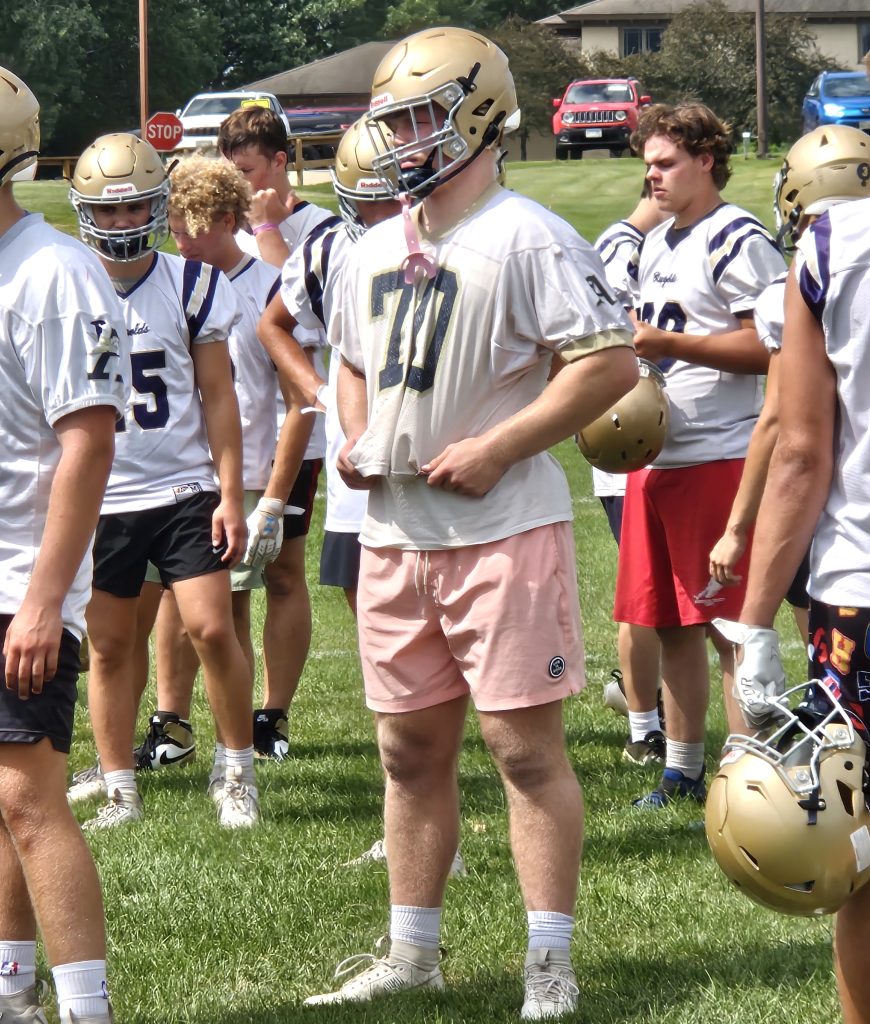 Aquinas senior Tyson Martin prepares to take part on a drill during Tuesday's first football practice of the season. -- TODD SOMMERFELDT PHOTO