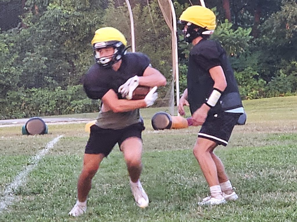 The Onalaska Luther football team runs a play at its practice field. -- TODD SOMMERFELDT PHOTO