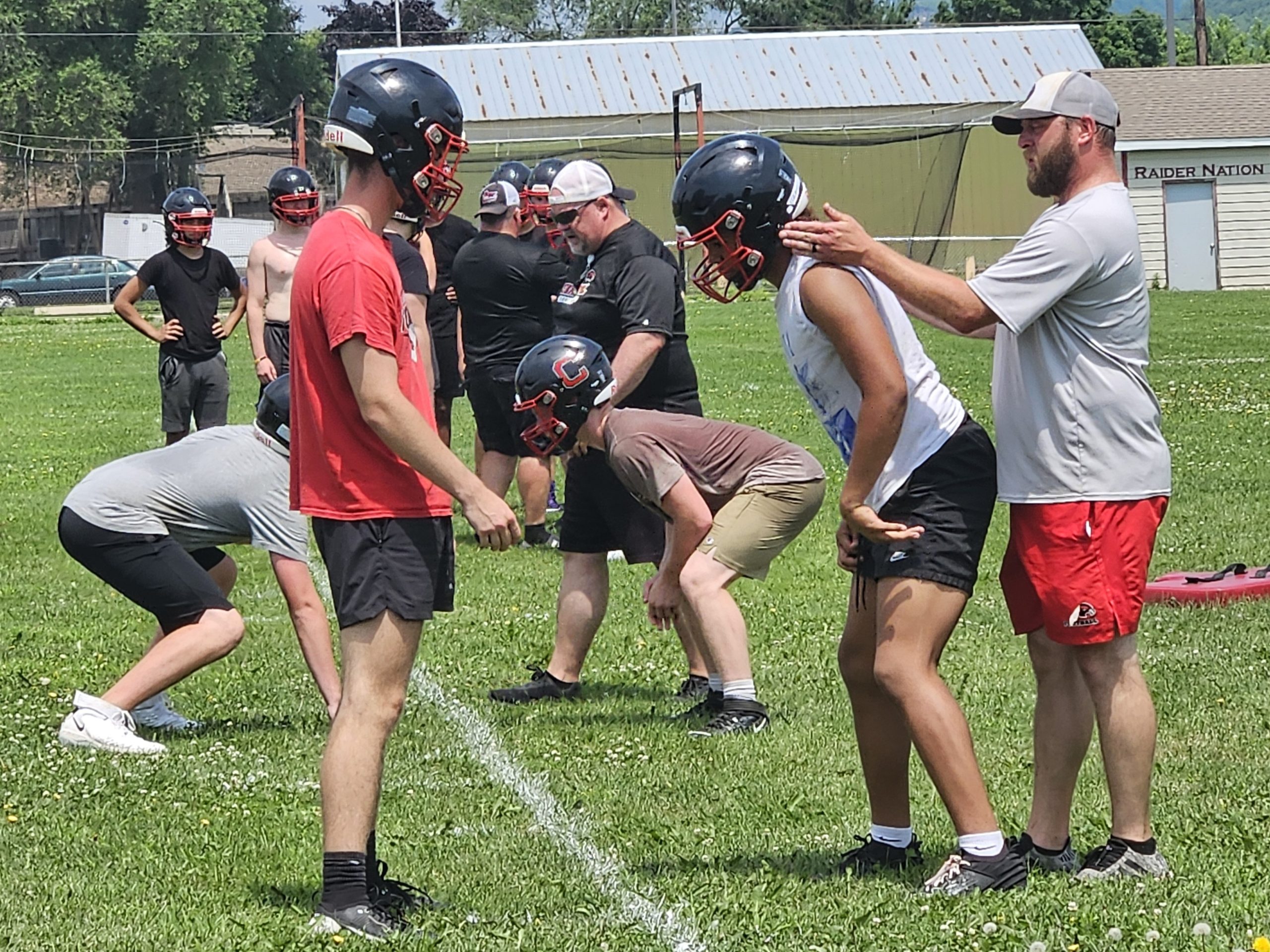 Central football coach Mitch Olson makes a point during a summer practice for the RiverHawks. -- TODD SOMMERFELDT PHOTO