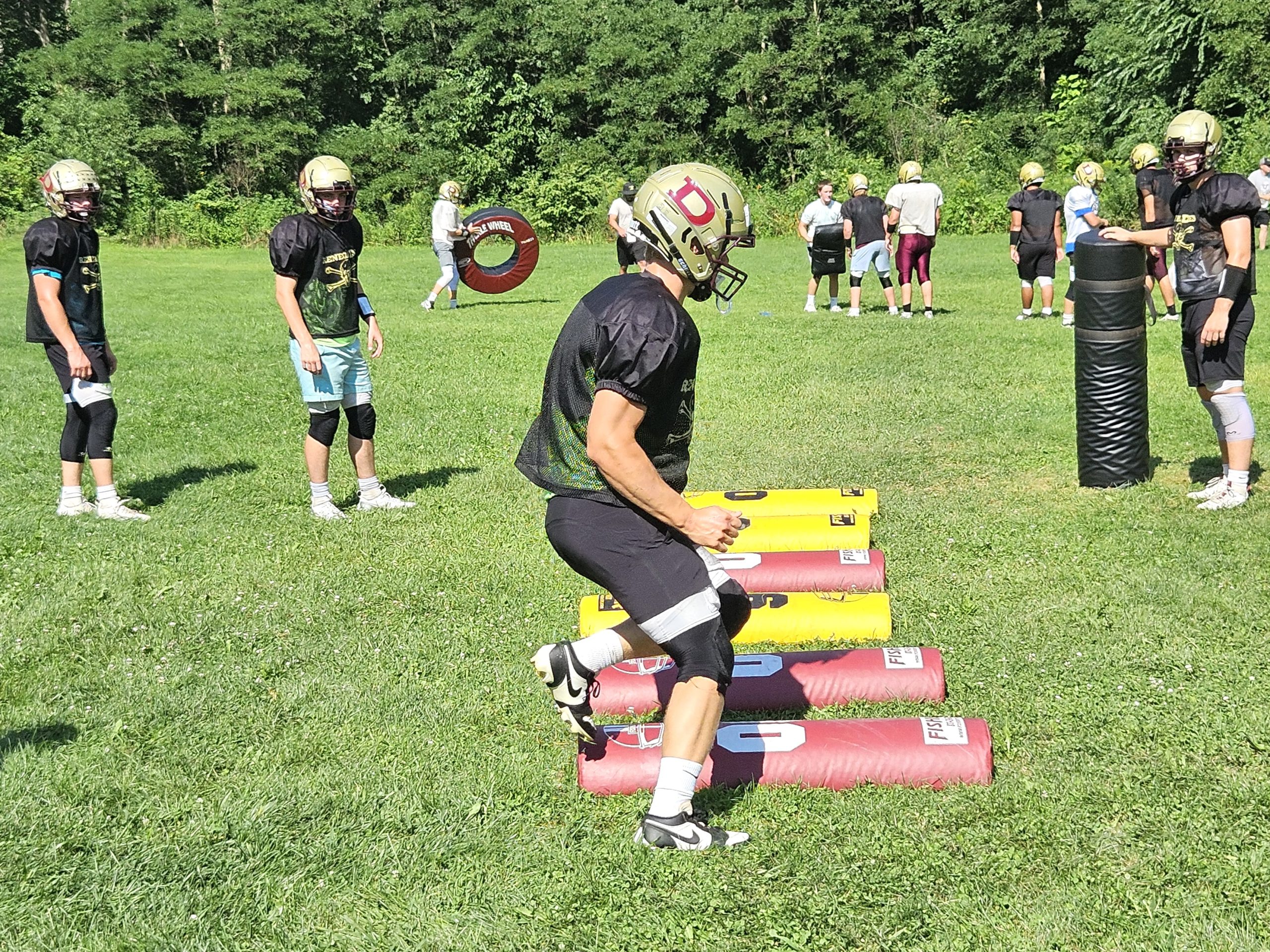The De Soto High School football team prepares for its first game of a new season. -- TODD SOMMERFELDT PHOTO