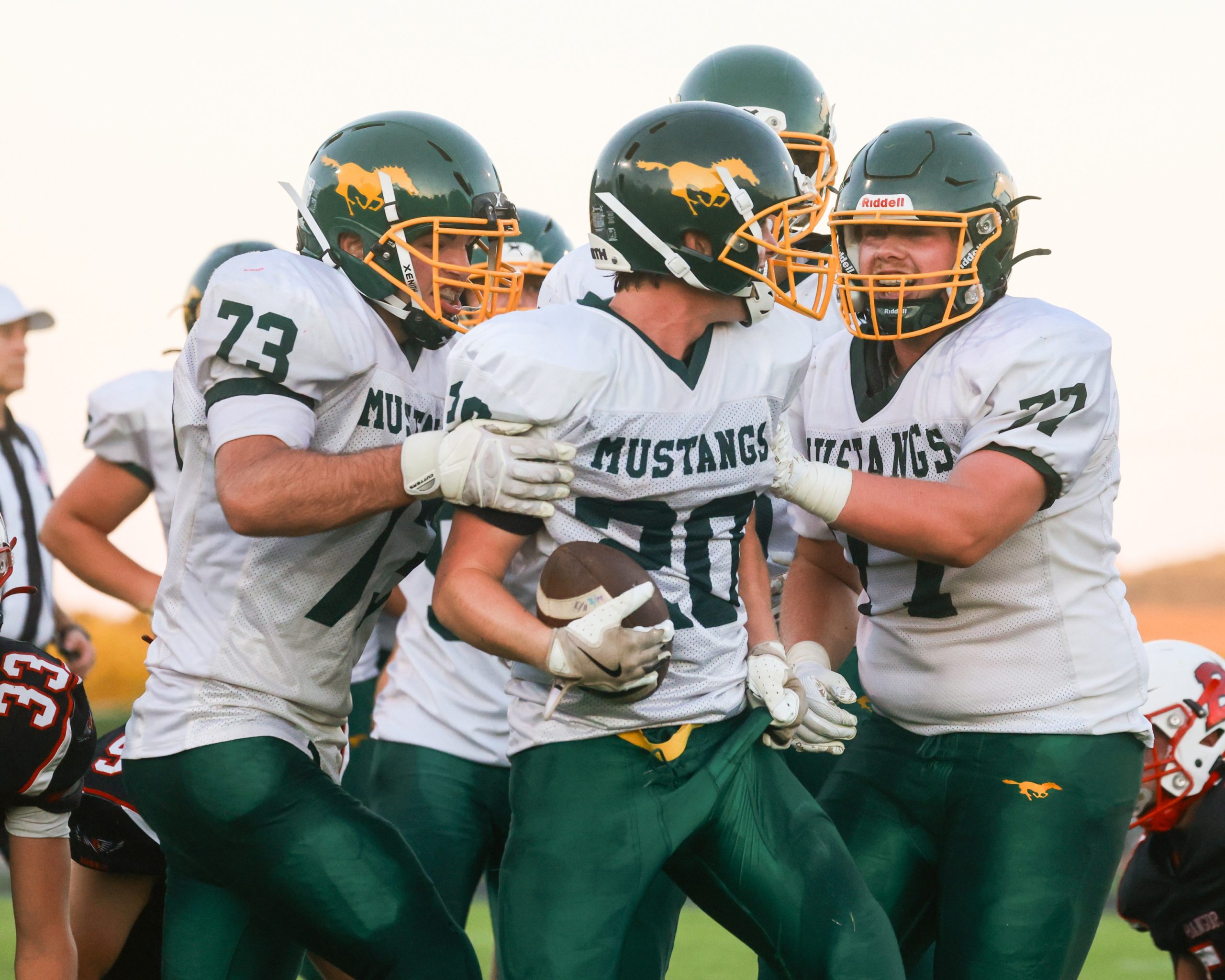 Members of the Melrose-Mindoro football team celebrate during Thursday's win over Bangor -- NATE BEIER PHOTO