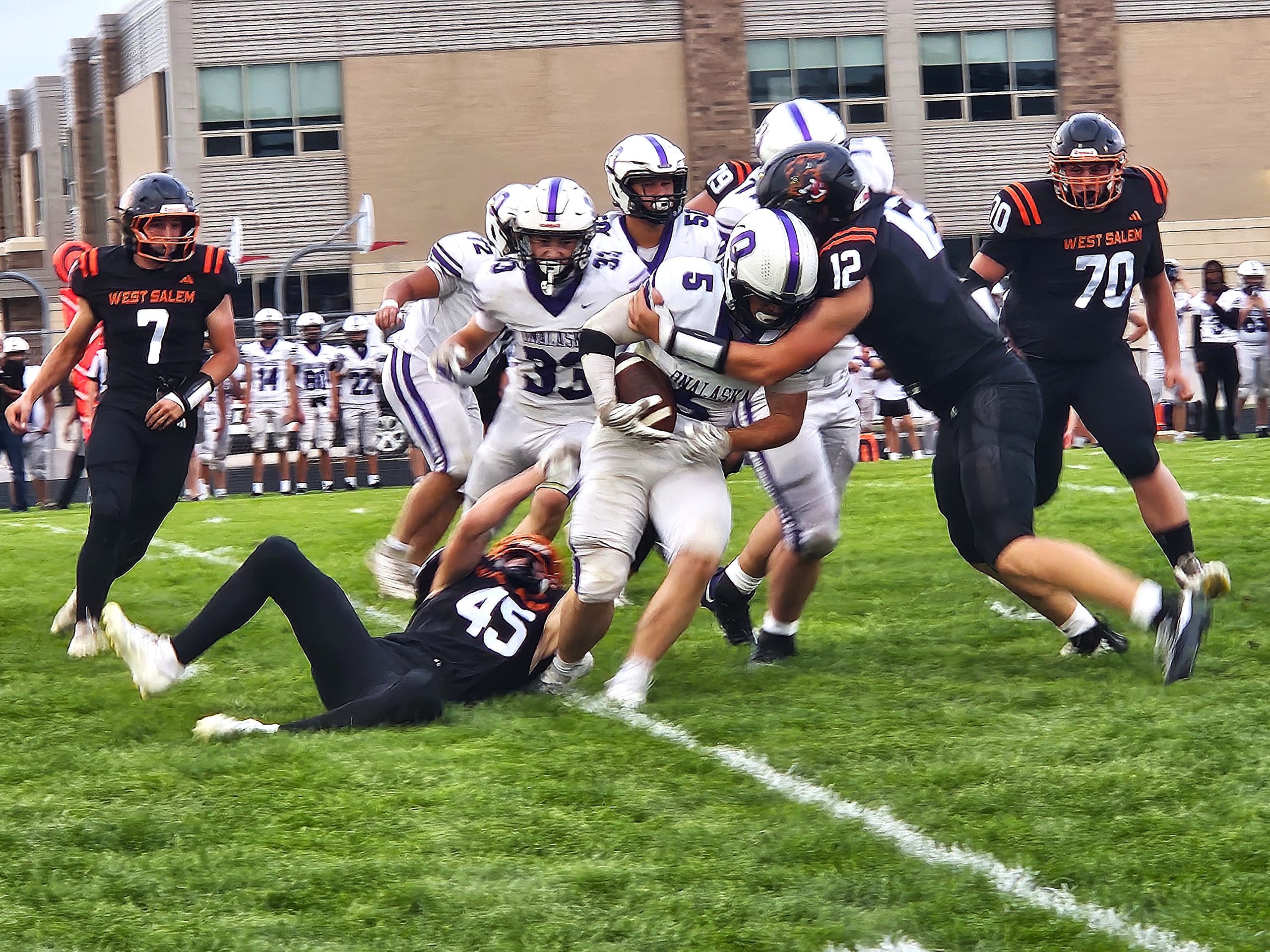 Onalaska's Carson Zinnecker is tackled during a nonconference football game against West Salem. -- TODD SOMMERFELDT PHOTO
