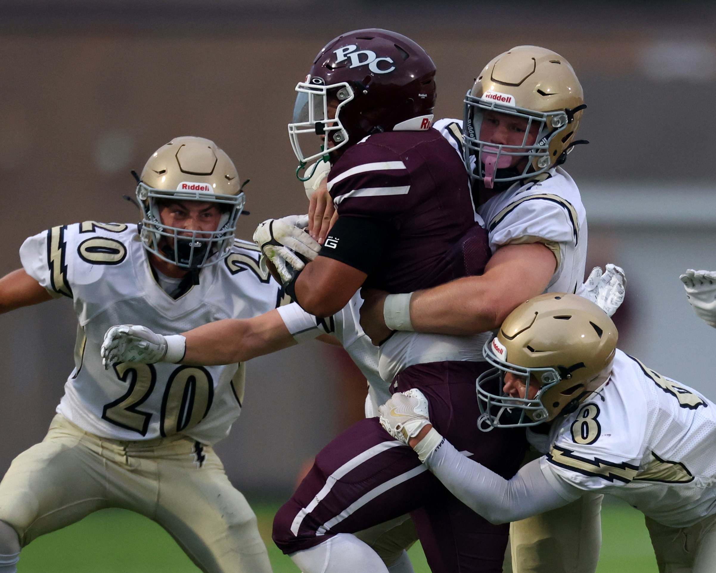 The Aquinas football team's defense makes a tackle during Friday's game at Prairie du Chien. -- NATE BEIER PHOTO