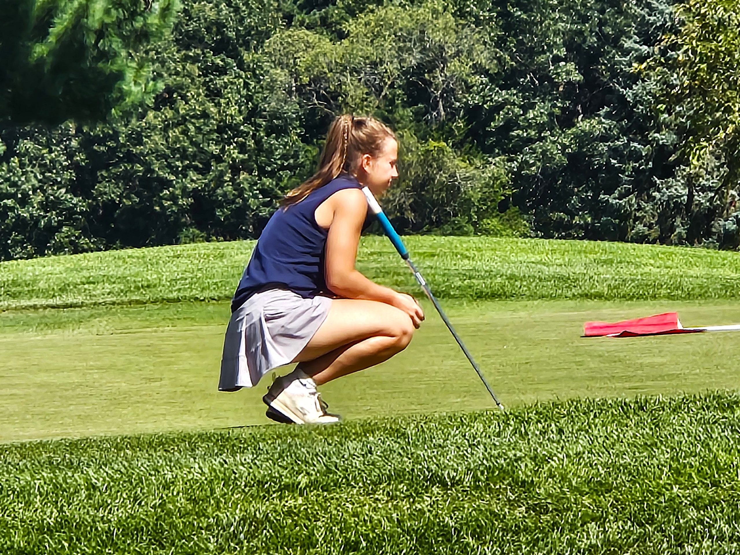 Aquinas senior Molly looks at her attempt at a putt during the Viking Classic at Drugan's Castle Mound. -- TODD SOMMERFELDT PHOTO