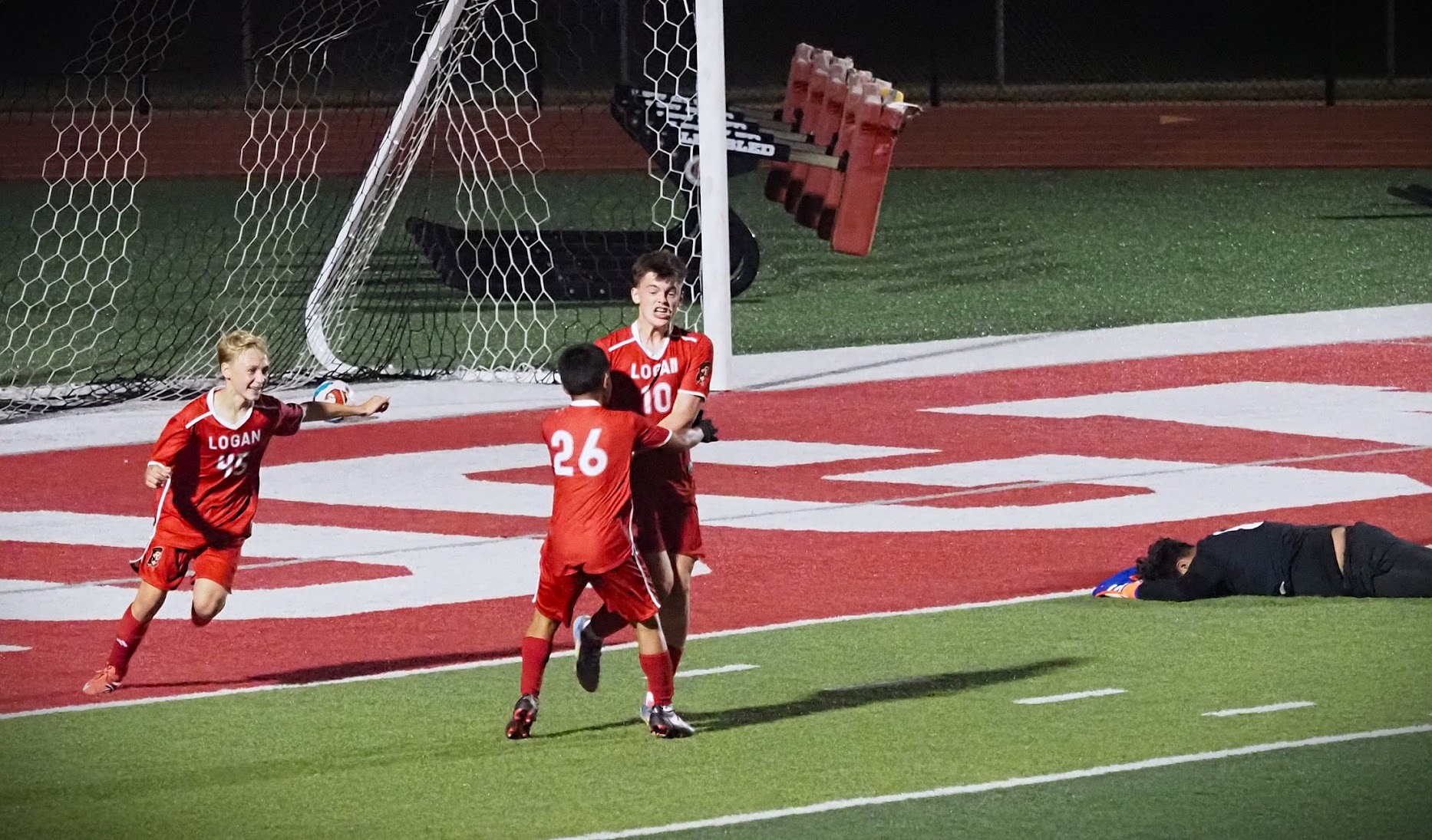 Members of the Logan boys soccer team celebrates a goal against Sparta at Swanson Field. -- TARA WALTERS PHOTO