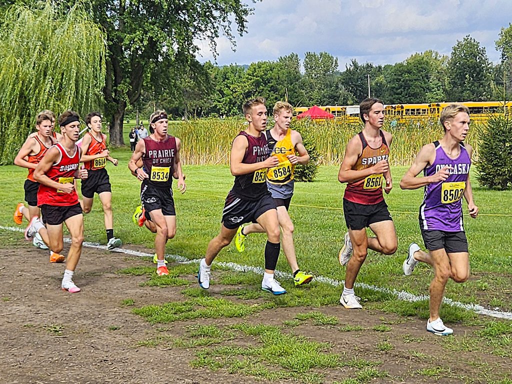 Onalaska's Carson Fink leads a pack of runners during the Gale Johnson Invitational at Maple Grove Venues. -- TODD SOMMERFELDT PHOTO