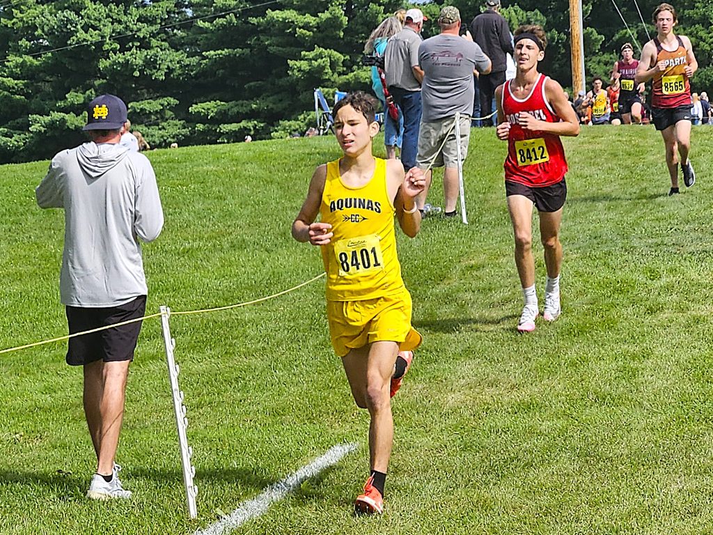 Aquinas senior Oliver Buck runs during the Gale Johnson Invitational at Maple Grove Venues. -- TODD SOMMERFELDT PHOTO