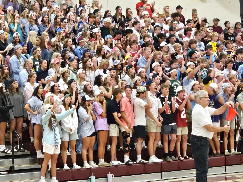 The Holmen student section cheers while watching its volleyball team play Aquinas at the Bernie L. Ferry Fieldhouse. -- TODD SOMMERFELDT PHOTO