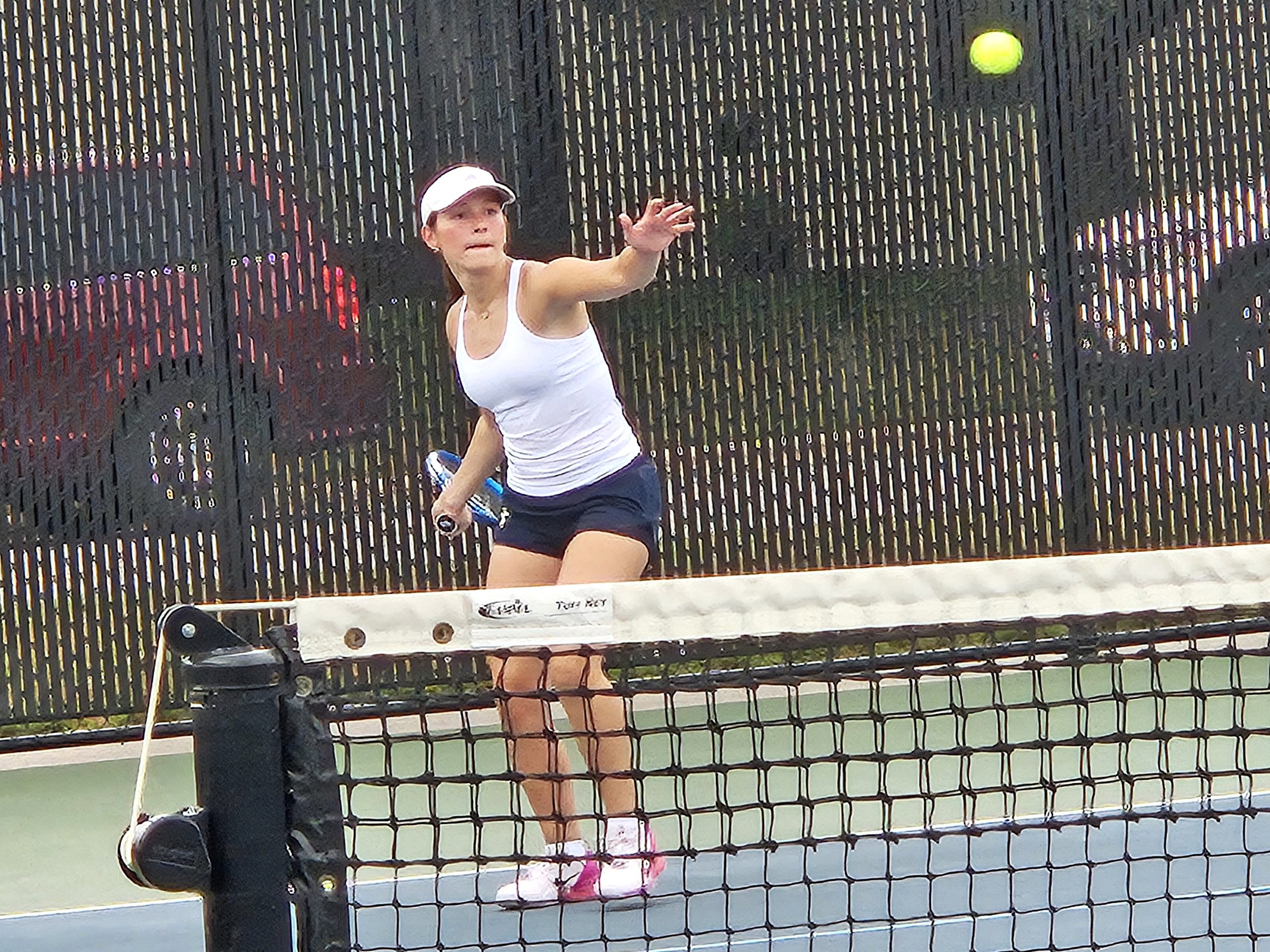 Aquinas junior Eva Willenbring send a shot over the net during a No. 3 singles match against Holmen on Tuesday. -- TODD SOMMERFELDT PHOTO