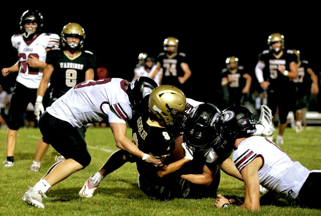 Caledonia's Ezekiel Gengler is tackled during a carry against Triton on Friday. -- CRAIG JOHNSON PHOTO