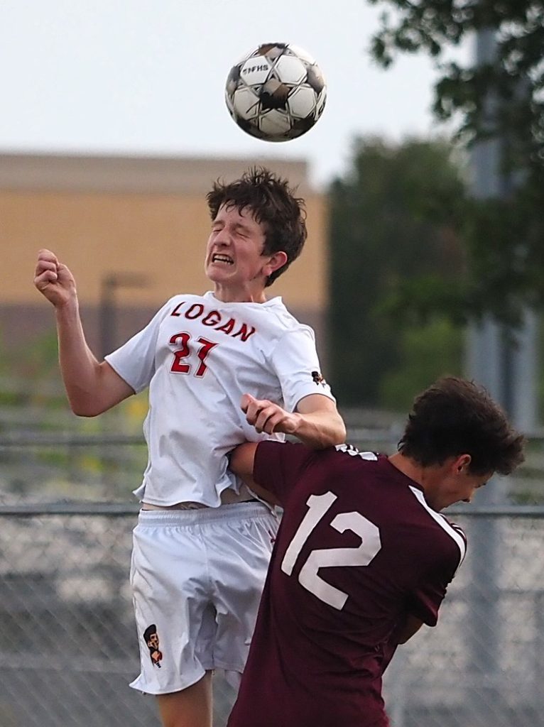 Logan's Elias Corell heads the ball during Thursday's soccer game against Holmen. -- TARA WALTERS PHOTO