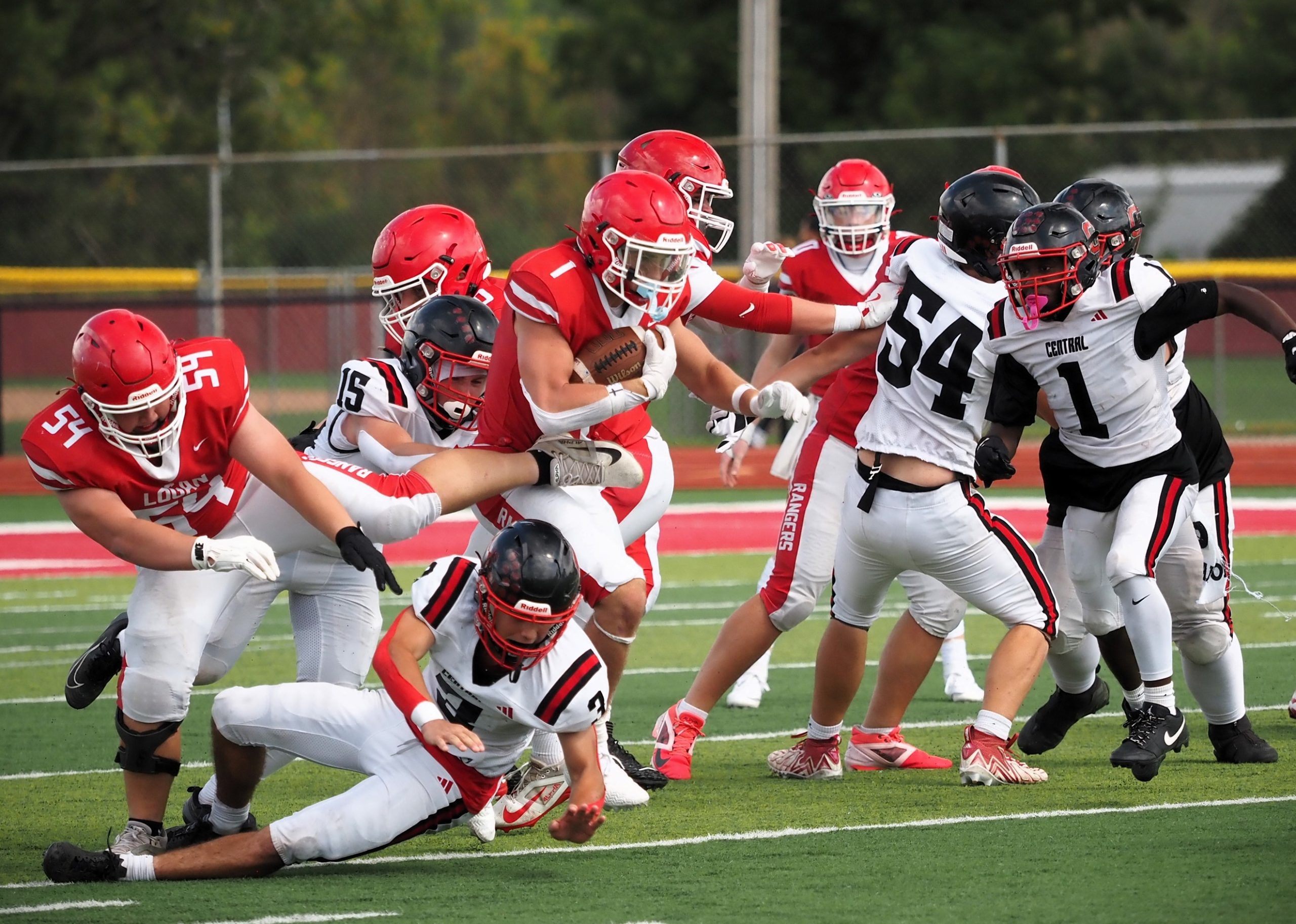 Logan running back Maxim Roberts fights for yards during Saturday's football game against Central at Swanson Field. -- TARA WALTERS PHOTO