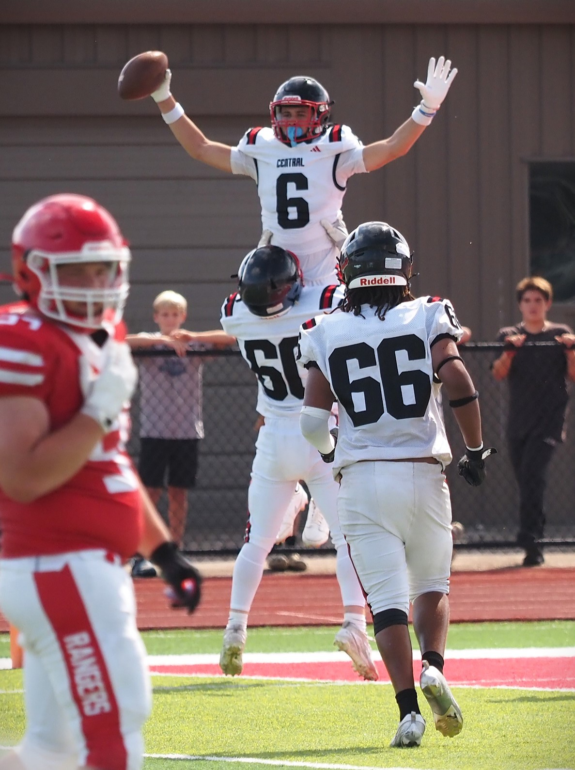 Central's Connor Groth celebrates a touchdown during Saturday's football game against Logan at Swanson Field. -- TARA WALTERS PHOTO