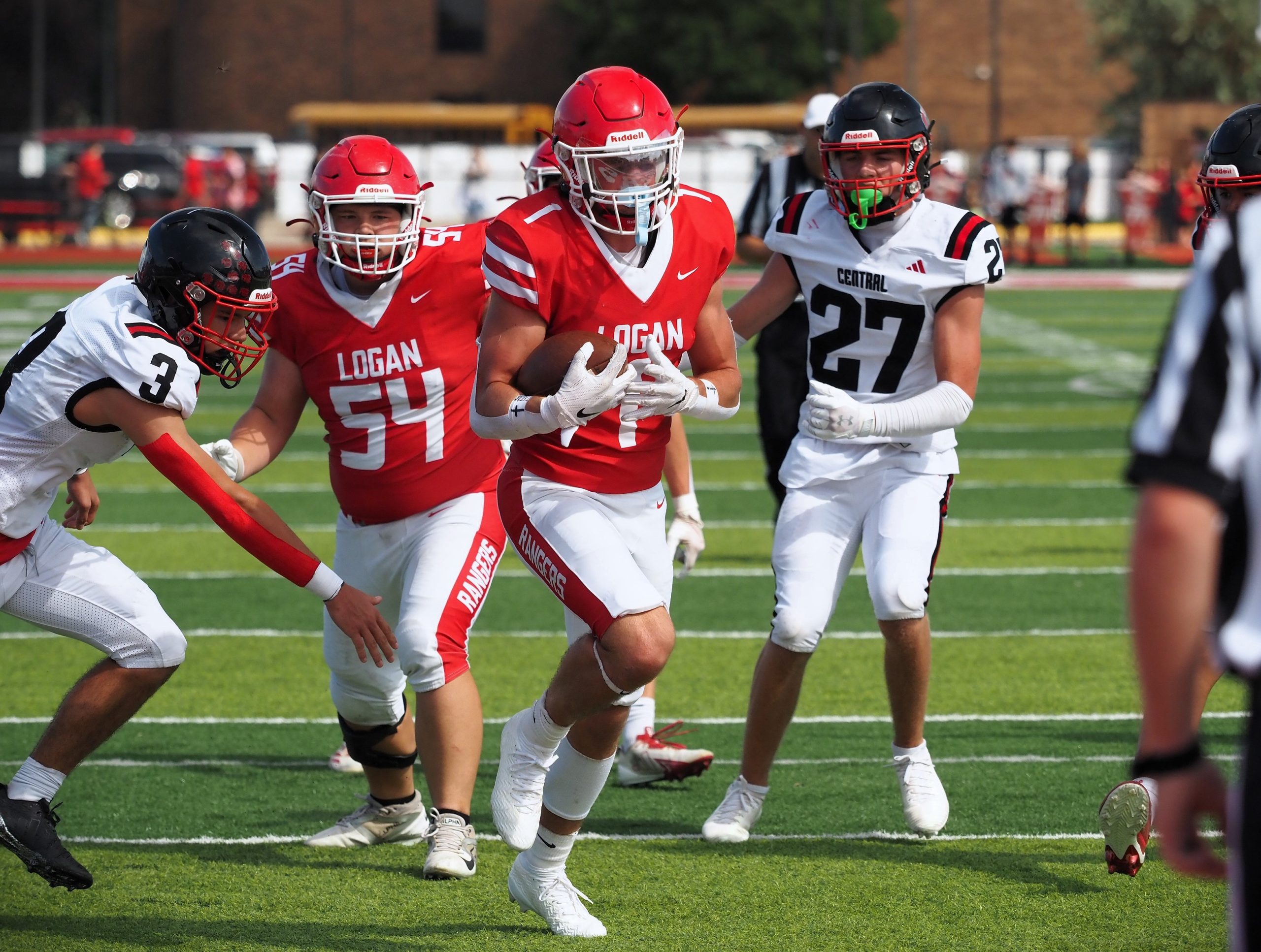 Logan's Maxim Roberts runs for the end zone during Saturday's football game against Central at Swanson Field. -- TARA WALTERS PHOTO