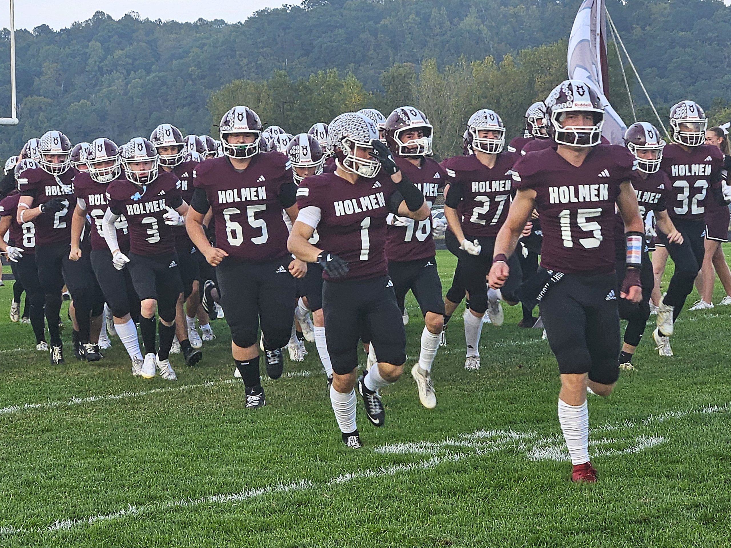 The Holmen fotball teams heads to the sideline prior to a game against Reedsburg at Empire Stadium. -- TODD SOMMERFELDT PHOTO