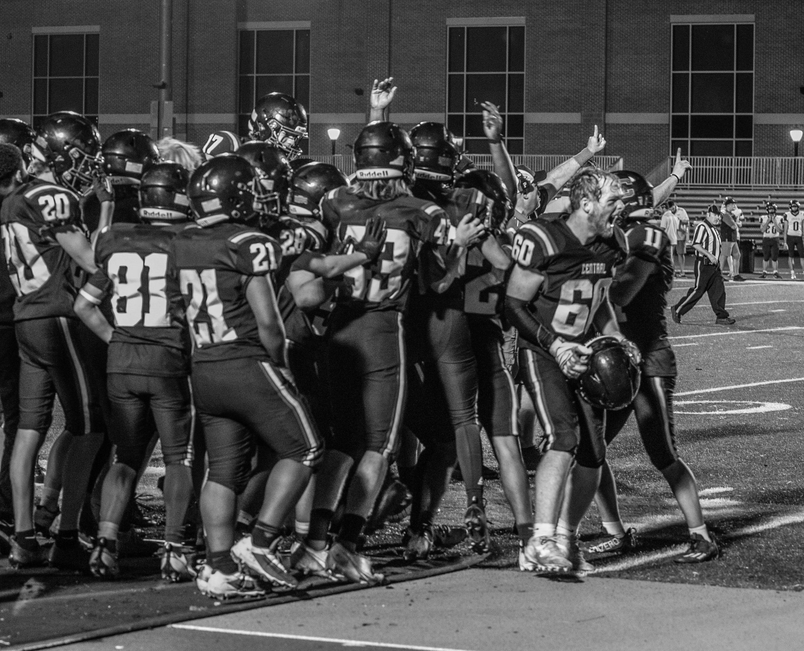 The first-place Central football team celebrates a 54-33 MVC victory over Sparta. -- KAYLEE ZIELKE PHOTO