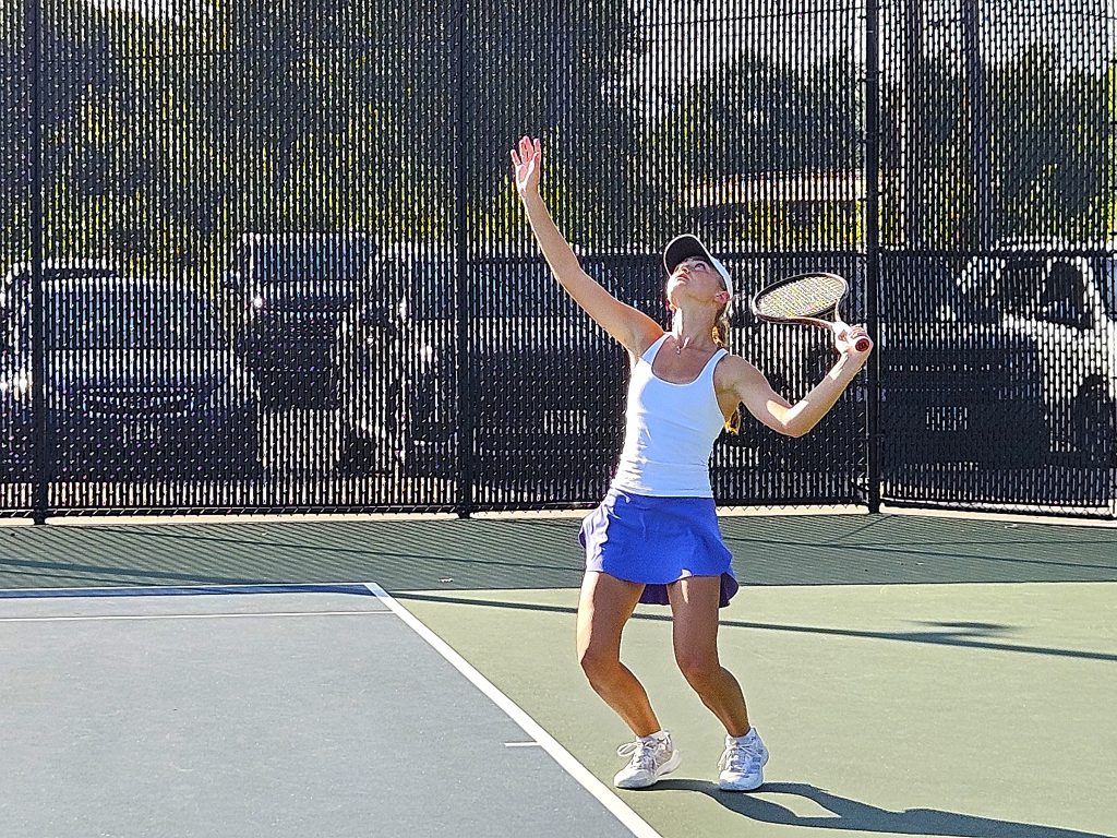 Onalaska No. 1 singles player Mara Klein serves during the MVC Tournament at Green Island on Monday. -- TODD SOMMERFELDT PHOTO
