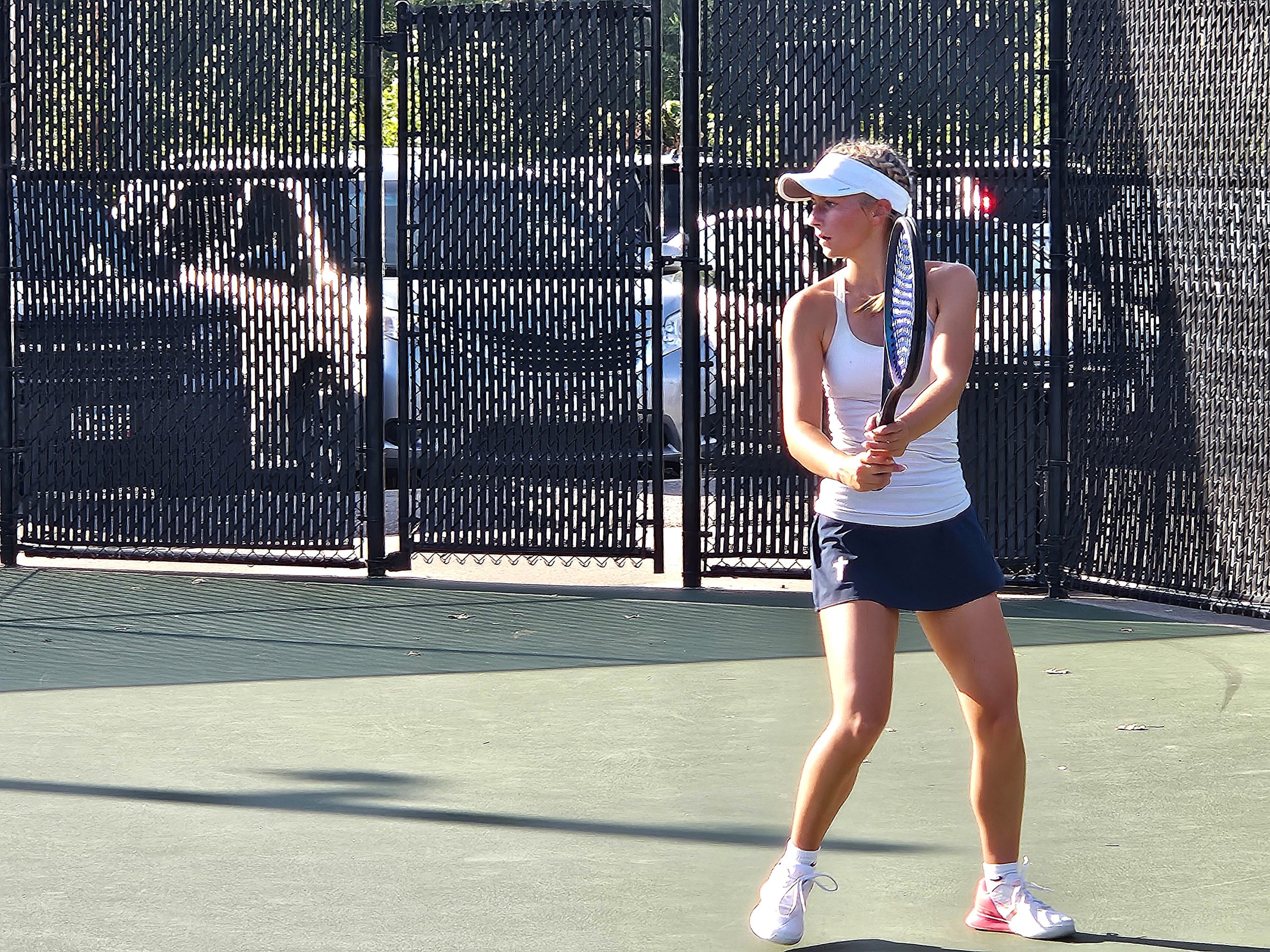 Aquinas No 1 singles player Tenzin Nelson readies for a swing during the MVC tournament on Monday. -- TODD SOMMERFELDT PHOTO
