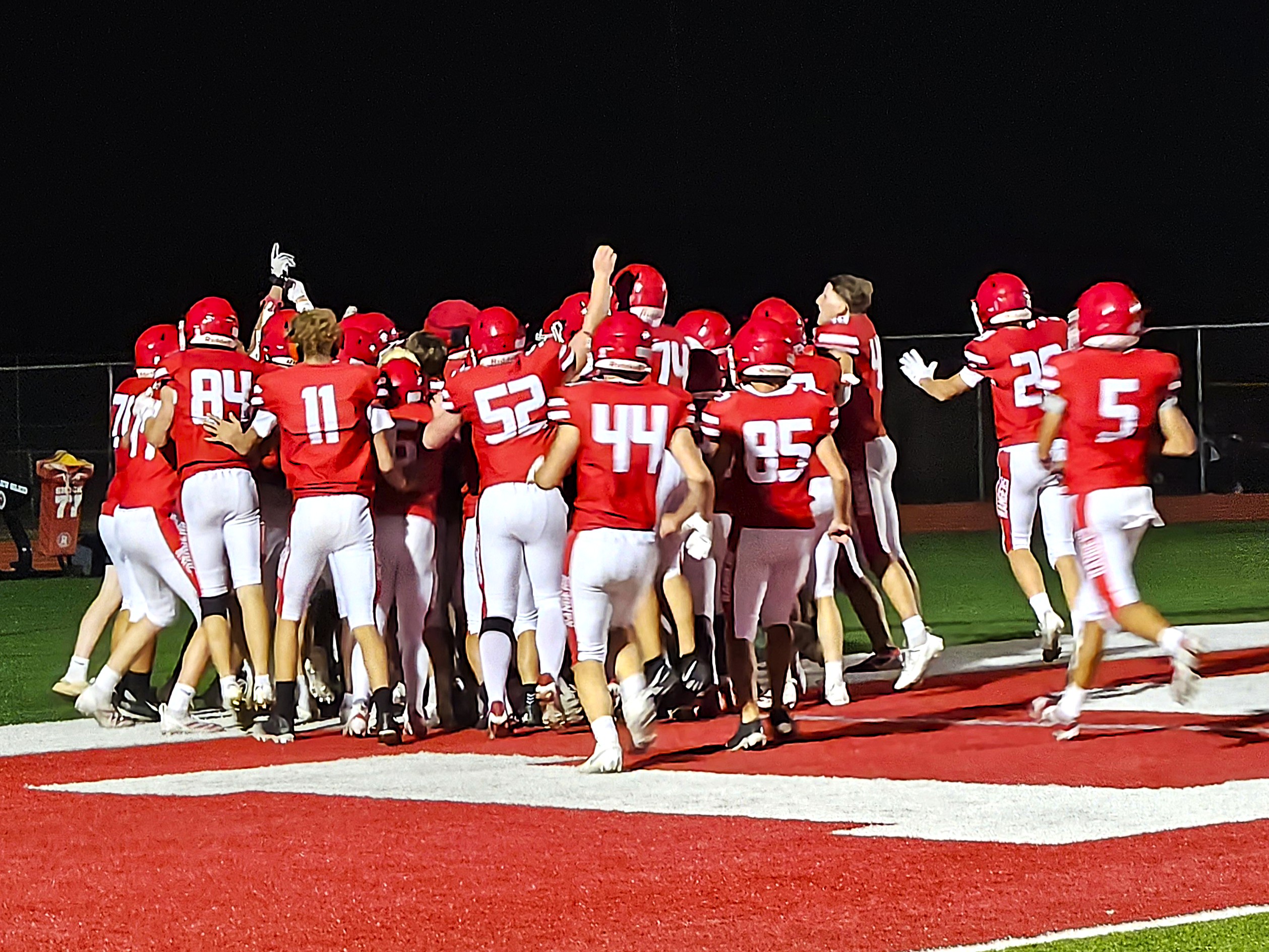 Members of the Logan football team run to the end zone to celebrate the winning touchdown by Maxim Roberts in Friday's 42-36 overtime victory over Reedsburg at Swanson Field. -- TODD SOMMERFELDT PHOTO