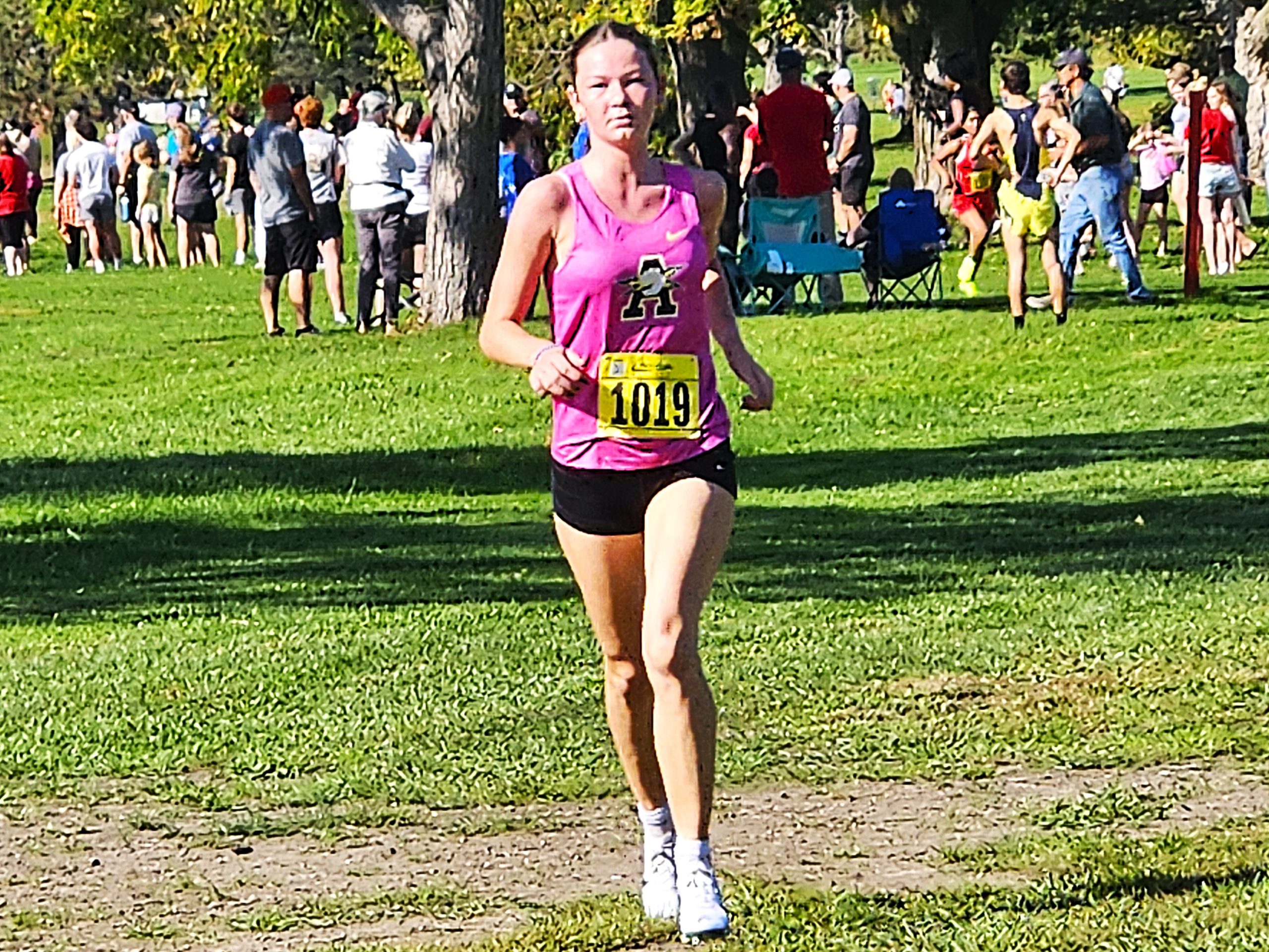 Aquinas junior Emily Bagniefski runs in the Dick Mitchell Invitational at Maple Grove Venues on Saturday. -- TODD SOMMERFELDT PHOTO