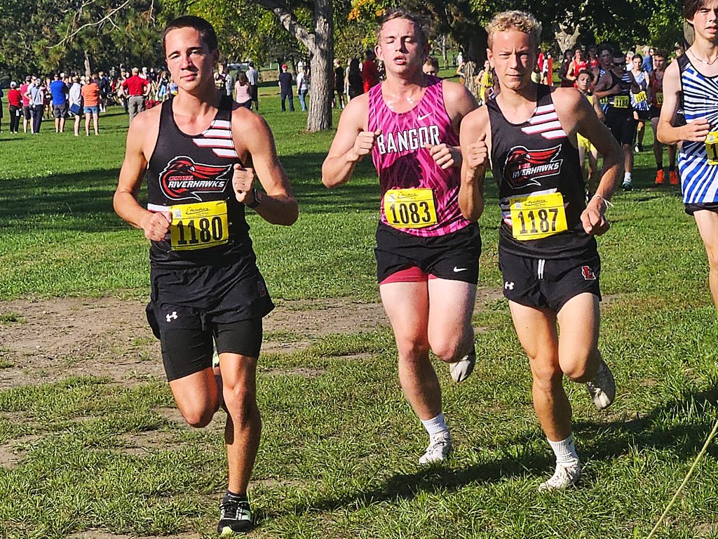 Central's Sean Erickson and Wesley Olson run in the Dick Mitchell Invitational at Maple Grove Venues on Saturday. -- TODD SOMMERFELDT PHOTO