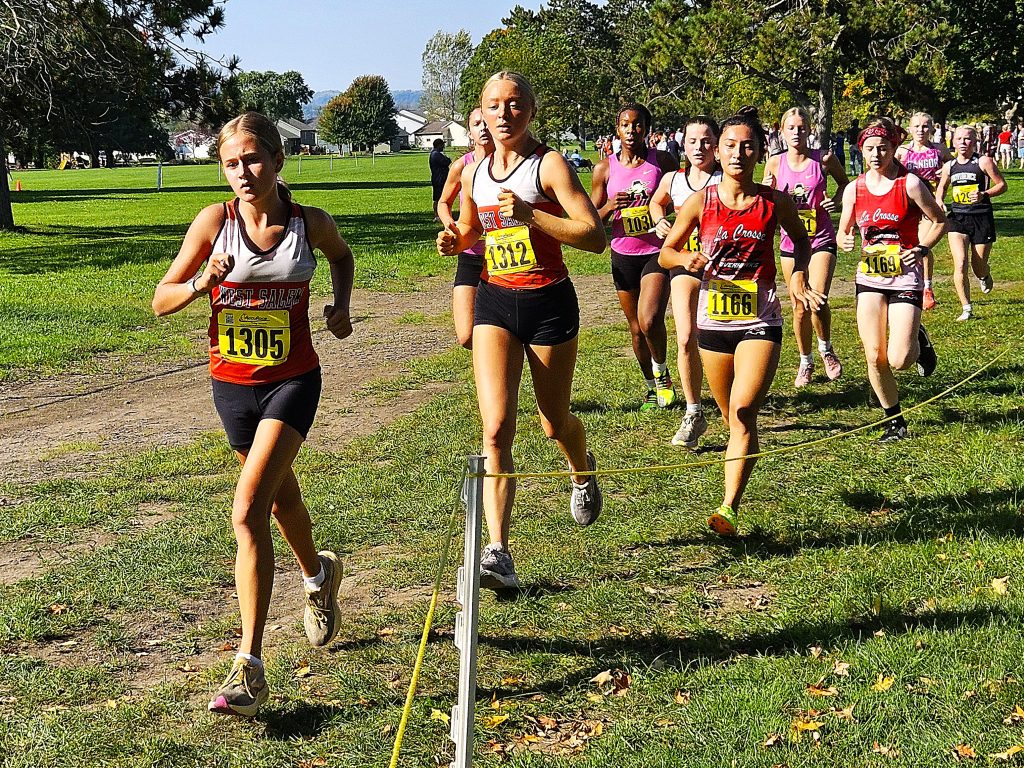 A group of local runners competes in the Dick Mitchell Invitational at Maple Grove Venues on Saturday. -- TODD SOMMERFELDT PHOTO