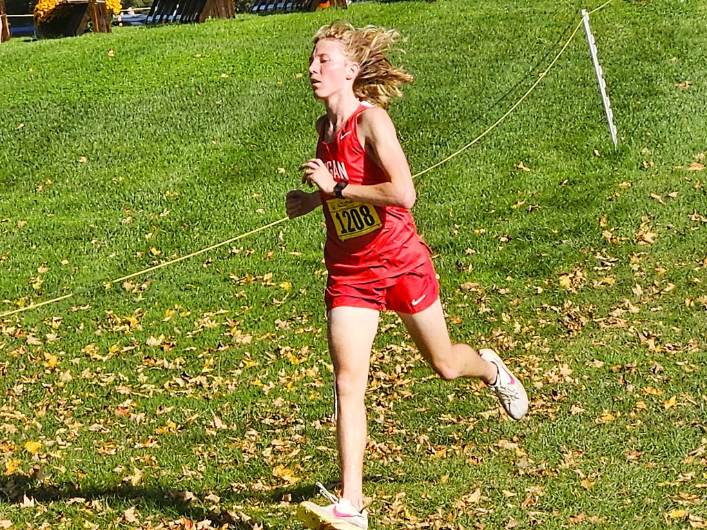 Logan junior Gabe Passe runs during the Dick Mitchell Invitational at Maple Grove Venues on Saturday. -- TODD SOMMERFELDT PHOTO