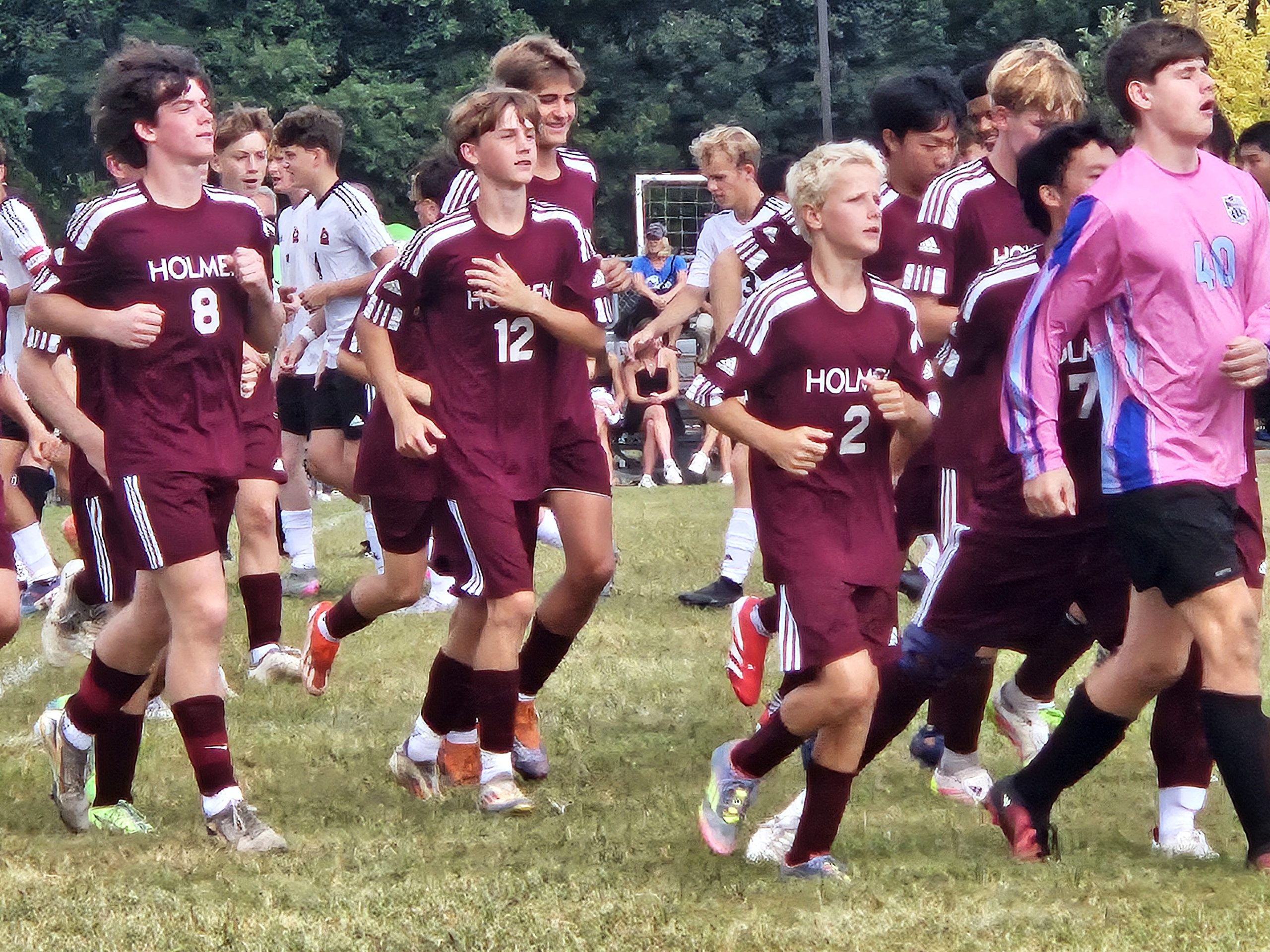 Members of the Holmen boys soccer team jog to the sideline before the start of a game. -- TODD SOMMERFELDT PHOTO