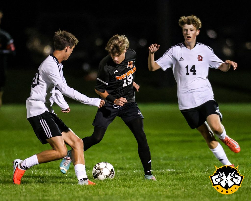West Salem's Kayden Tauscher dribbles the ball between La Crosse Central's William Frandsen (10) and Oliver Kayson (14) during the first half of Tuesday's Mississippi Valley Conference game. Photo by Nate Beier/GX3 Media.