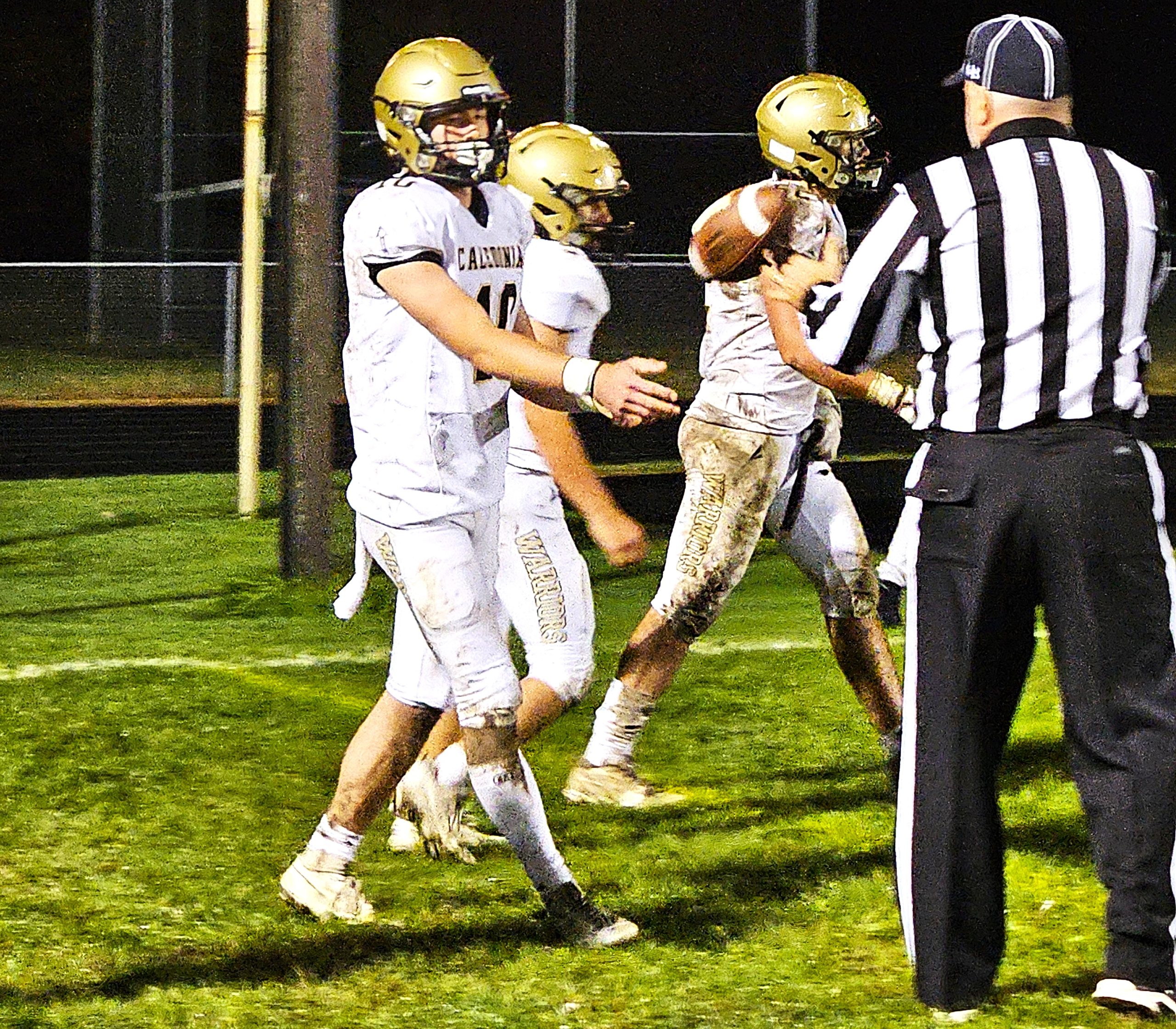 Caledonia quarterback Will Allen tosses the football to the referee after scoring a touchdown during a 40-7 win at La Crescent-Hokah. -- TODD SOMMERFELDT PHOTO