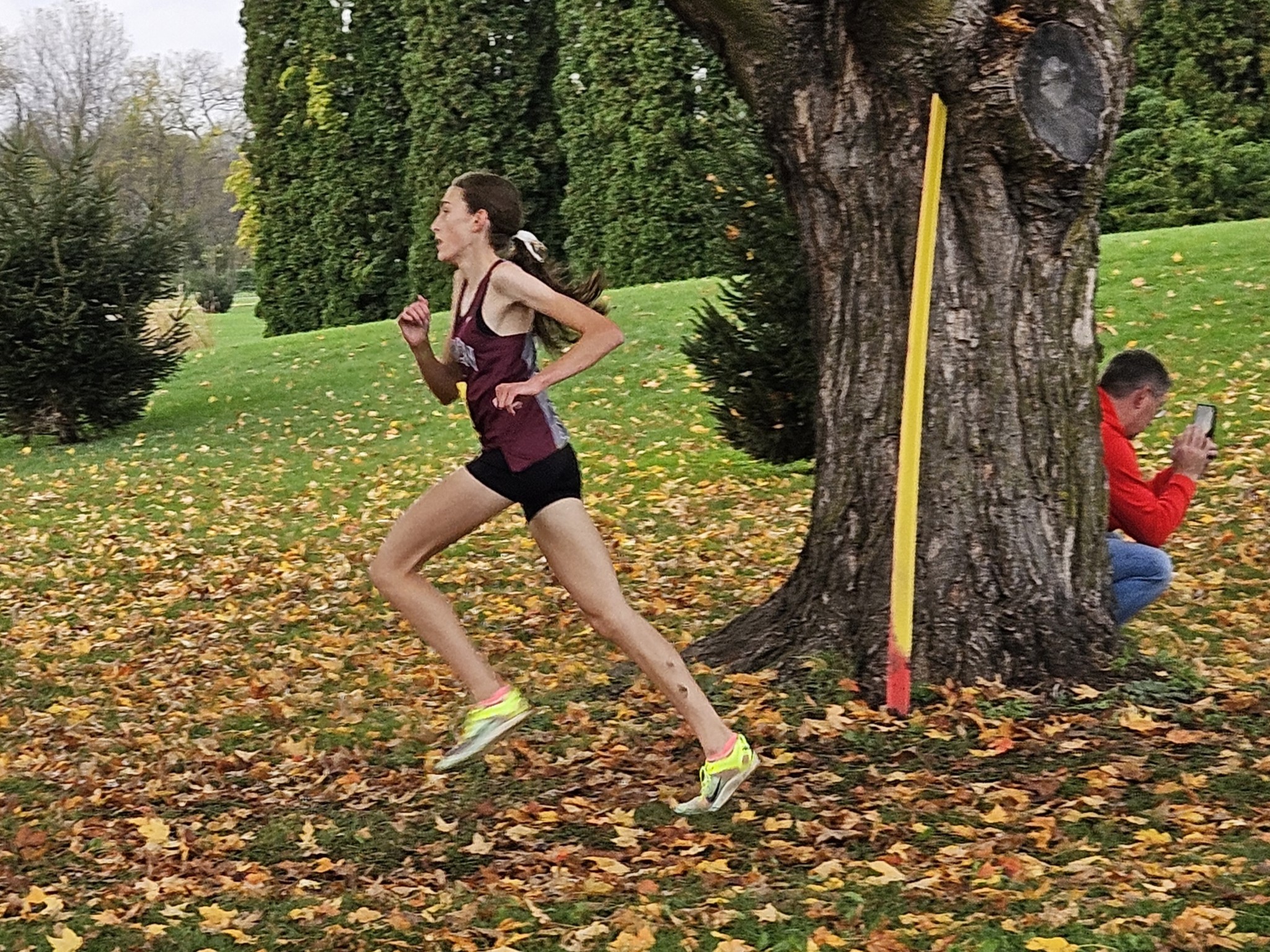 Holmen senior Sabrina Lechnir runs past a tree during the MVC cross country meet at Maple Grove Venues. -- TODD SOMMERFELDT PHOTO