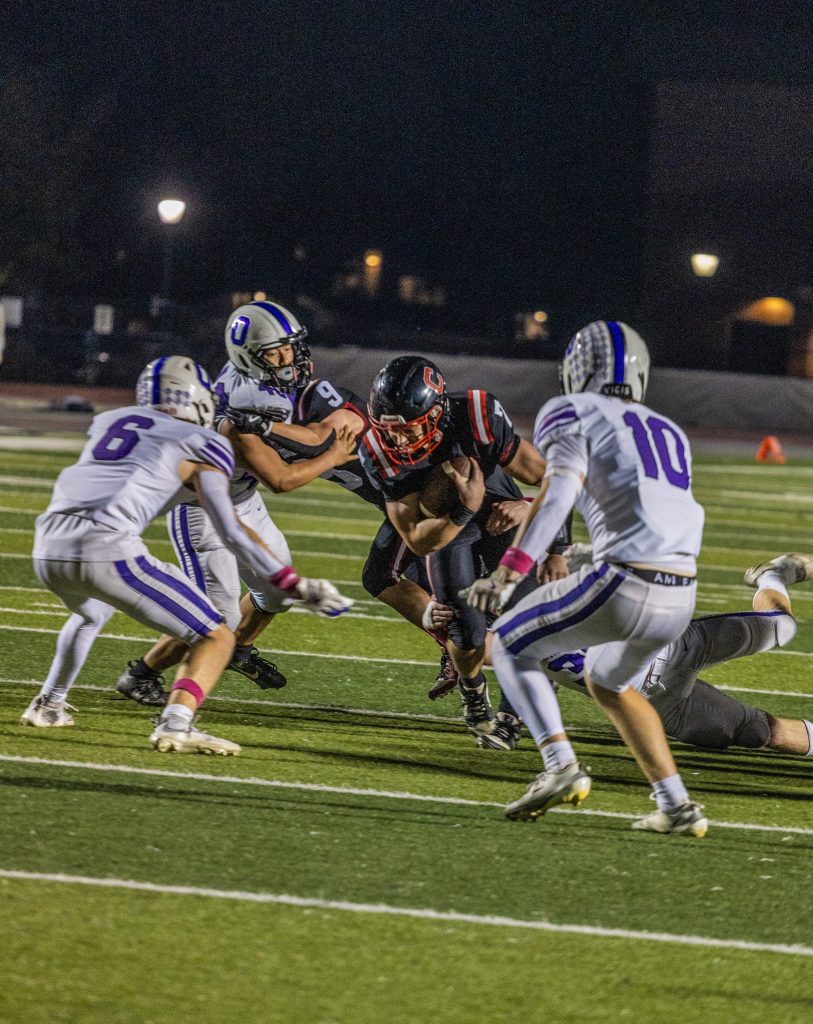 Central quarterback Christian Rudrud looks for yards in an MVC football game against Onalaska. -- KAYLEE ZIELKE PHOTO