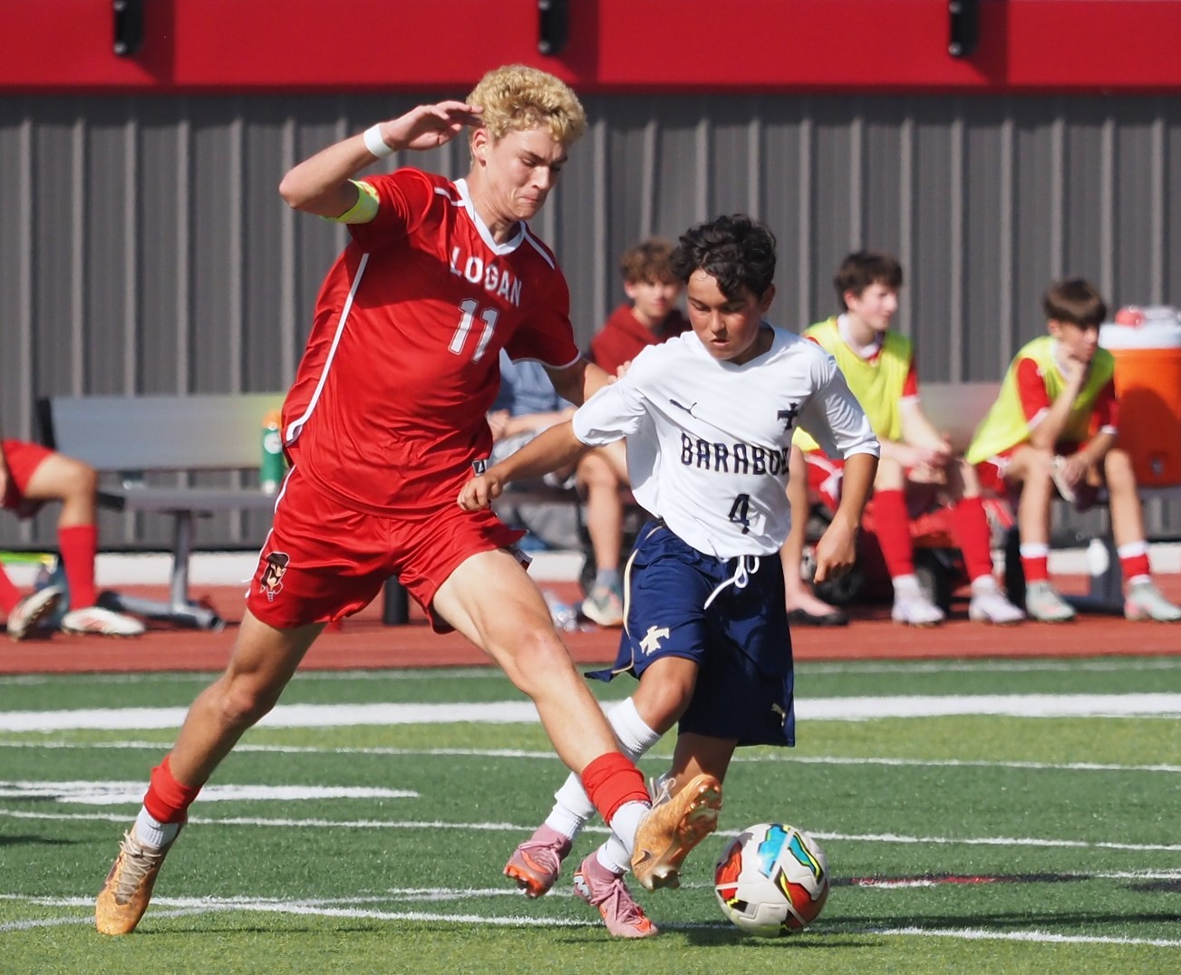 Logan senior Aidan Kuelz takes the ball from Baraboo's Finnley Schindler during their soccer game Saturday afternoon at Swanson Field. Baraboo won 7-1. -- TARA WALTERS PHOTO