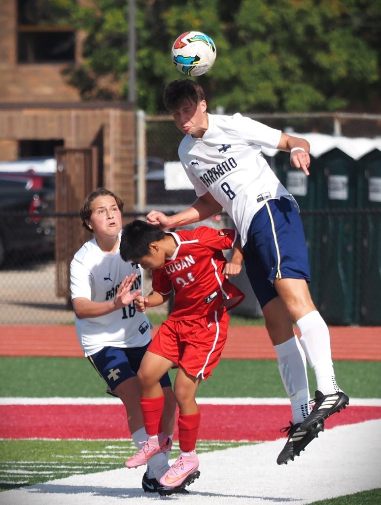 Logan's Sengpao Xiong gets caught between Baraboo players Brodie Ruff and Henri Letendre. -- TARA WALTERS PHOTO