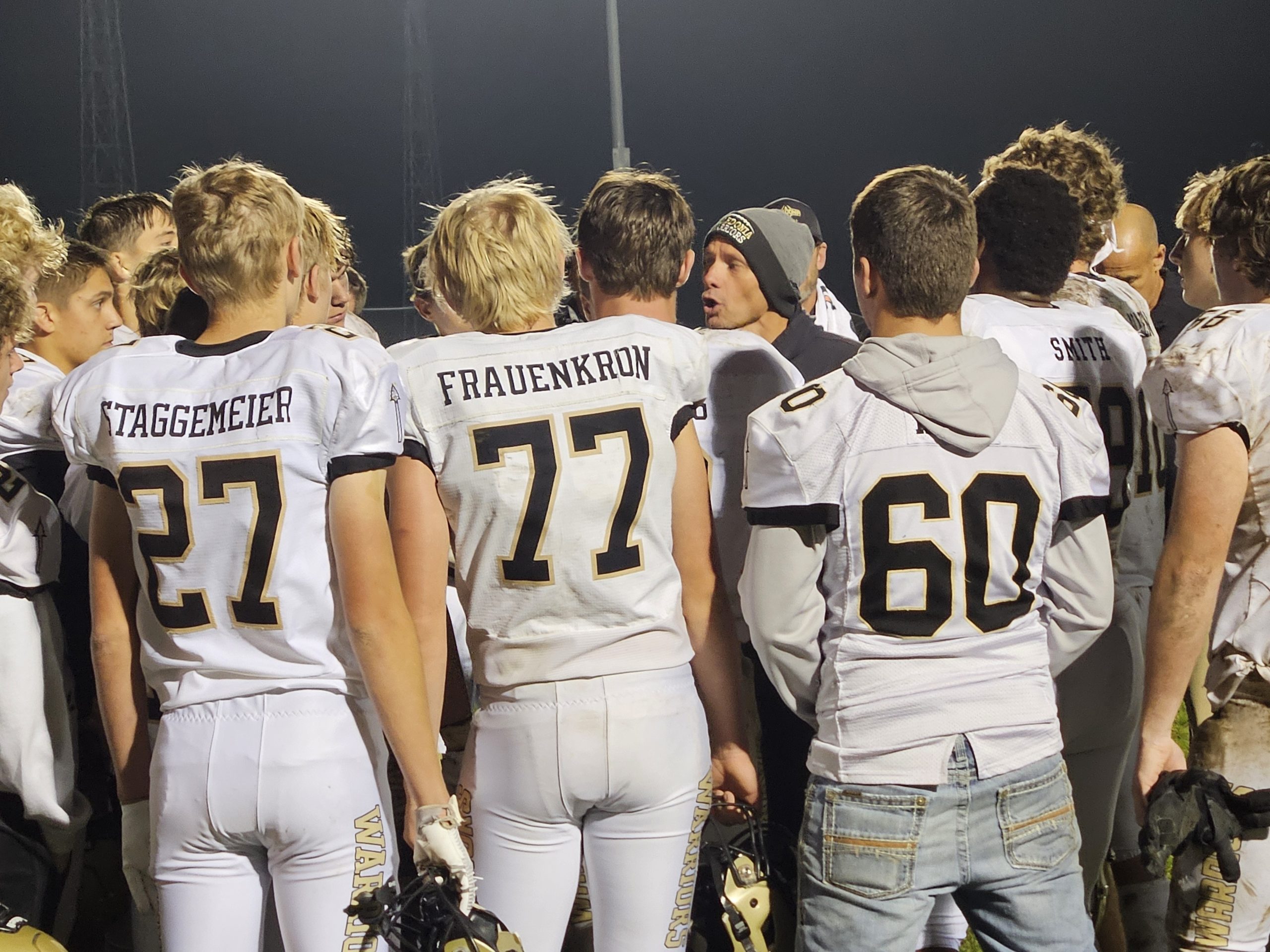 Caledonia football coach Carl Fruechte addresses his team after a regular-season win over La Crescent-Hokah. -- TODD SOMMERFELDT PHOTO