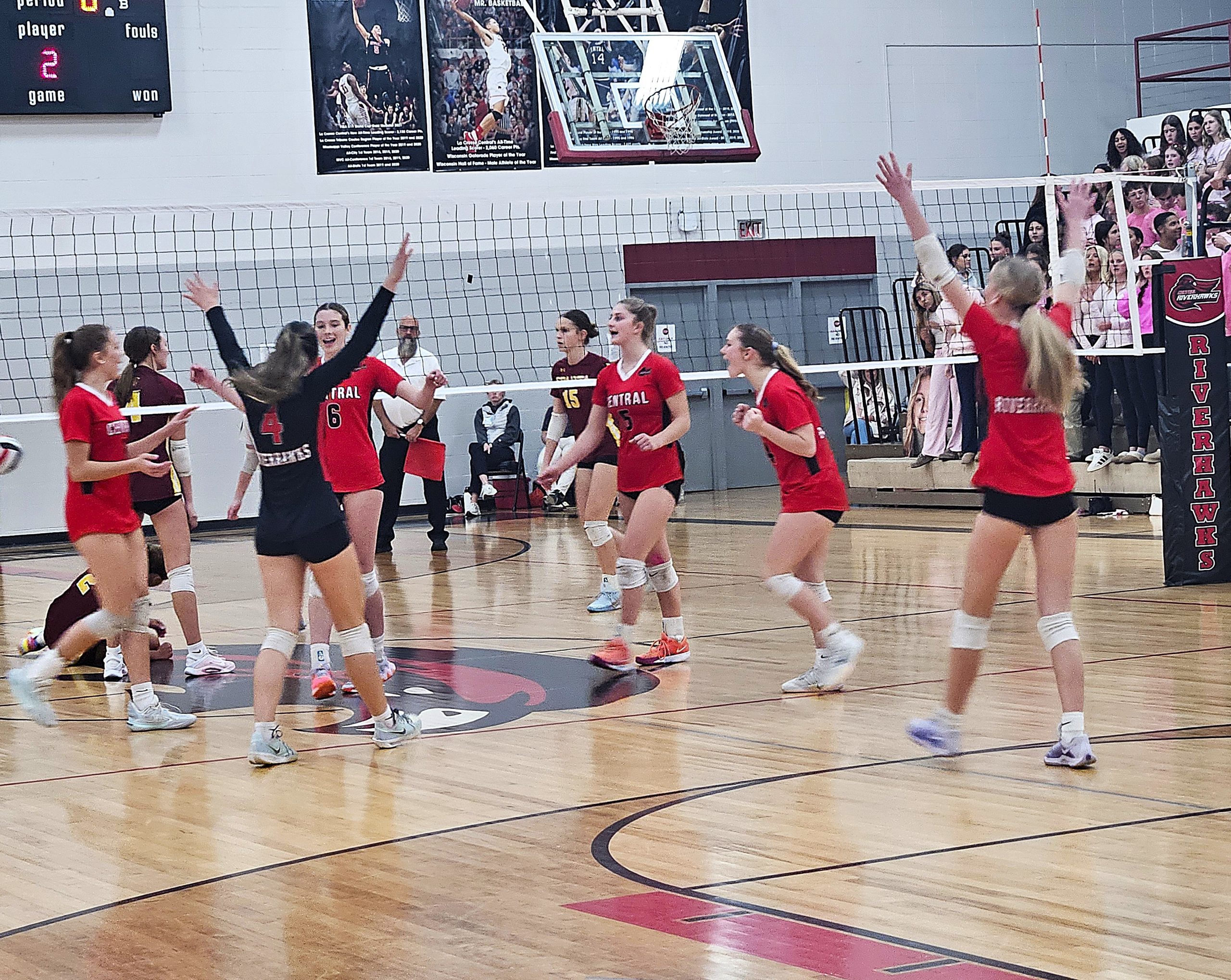 The Central volleyball team celebrates a point during the second set of a WIAA Division 1 regional sweep of Sparta. -- TODD SOMMERFELDT PHOTO