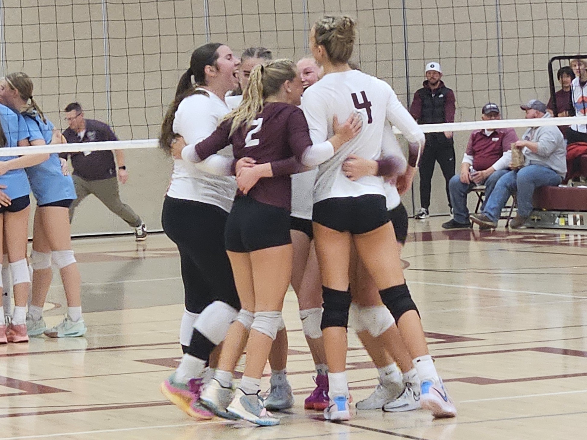 The Holmen volleyball team celebrates the final point in a WIAA Division 1 regional championship win over Monona Grove. -- TODD SOMMERFELDT PHOTO