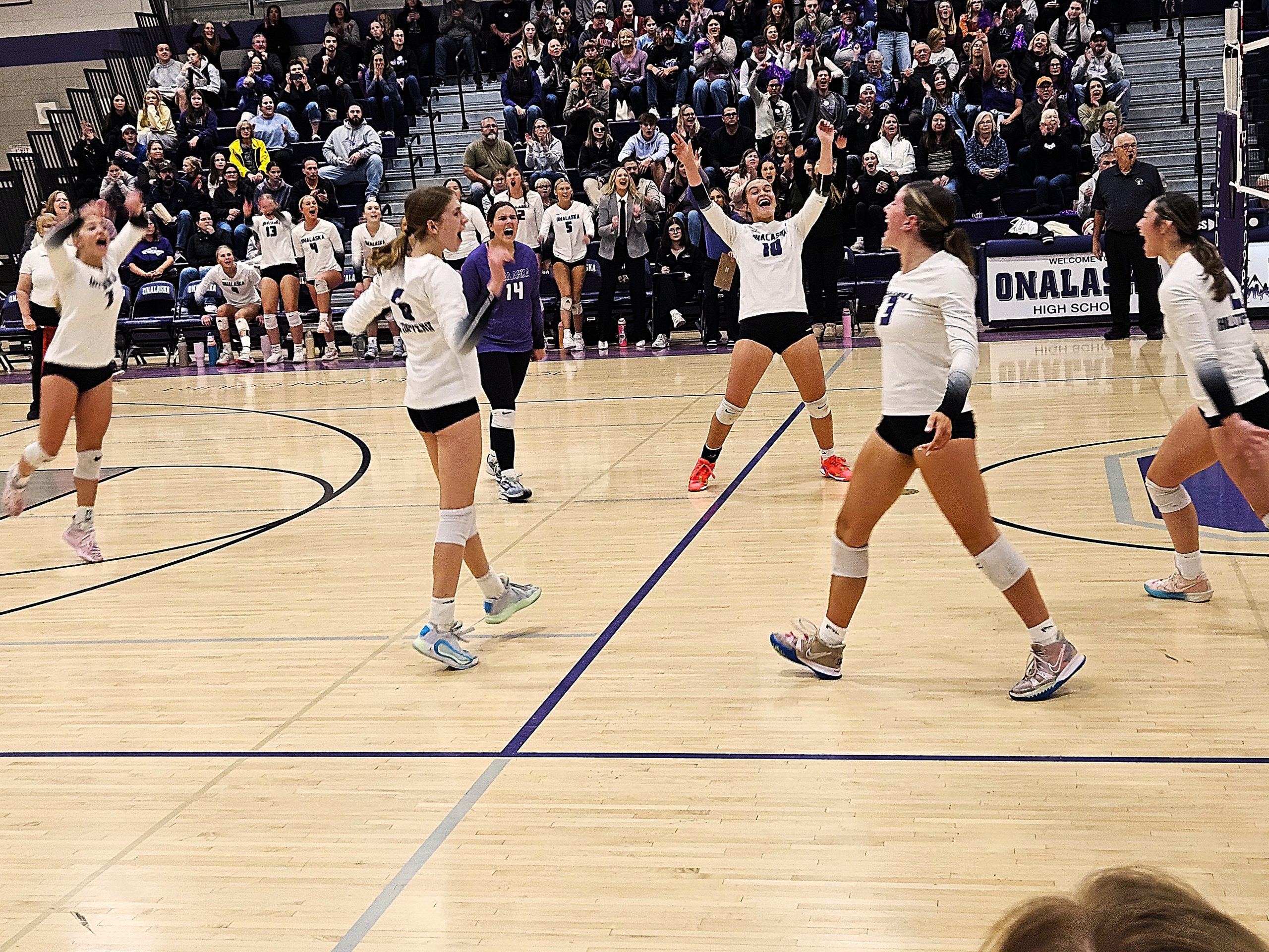 The Onalaska volleyball team celebrates a point during Saturday's WIAA Division 1 regional championship win over Middleton. -- TODD SOMMERFELDT PHOTO